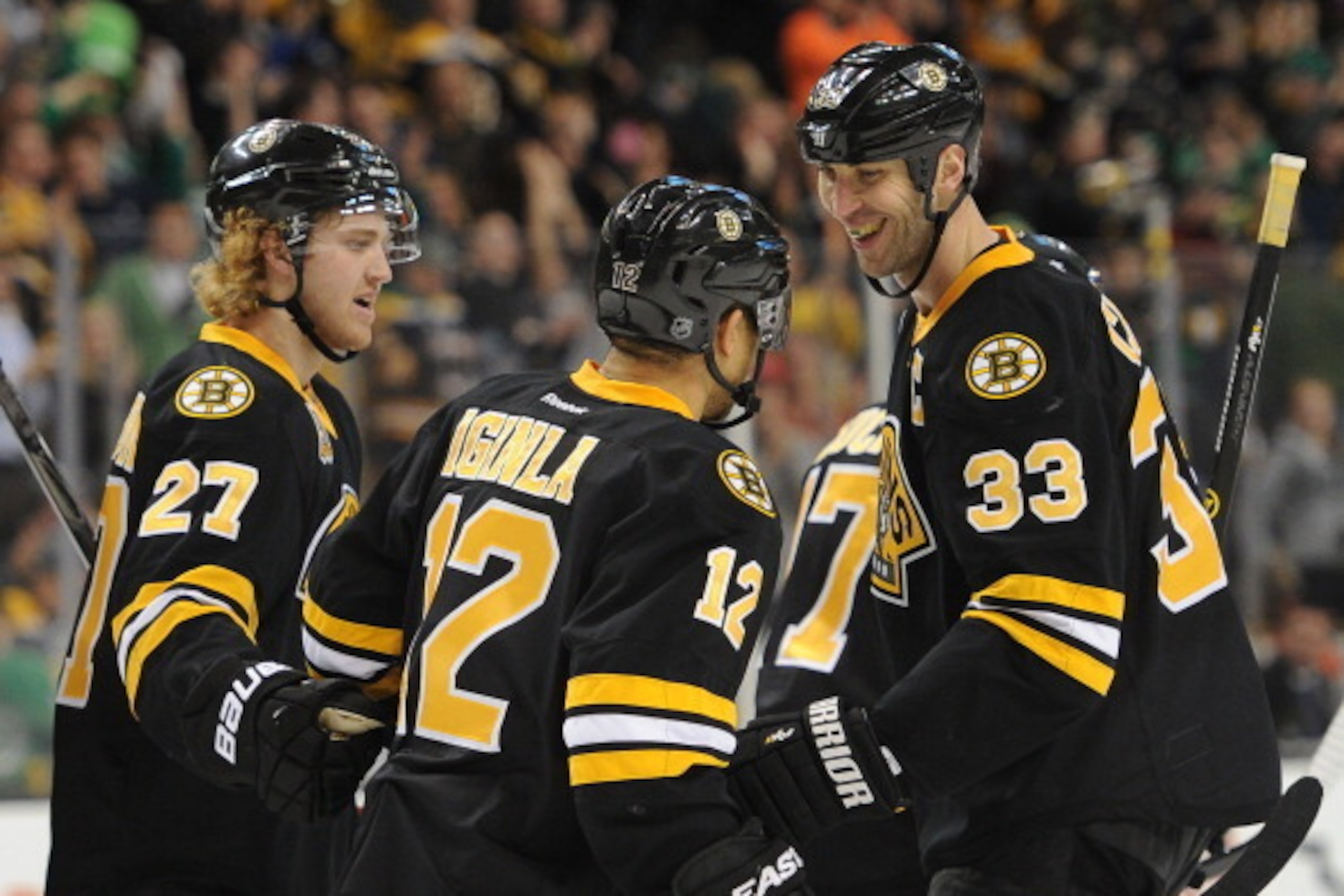 BOSTON, MA - MARCH 17: Zdeno Chara #33 of the Boston Bruins smiles at team mates Jarome Iginla #12 and Dougie Hamilton #27 after scoring a goal against the Minnesota Wild at the TD Garden on March 17, 2014 in Boston, Massachusetts. (Photo by Brian Babine BOSTON, MA - MARCH 17: Zdeno Chara #33 of the Boston Bruins smiles at team mates Jarome Iginla #12 and Dougie Hamilton #27 after scoring a goal against the Minnesota Wild at the TD Garden on March 17, 2014 in Boston, Massachusetts. (Photo by Brian Babine