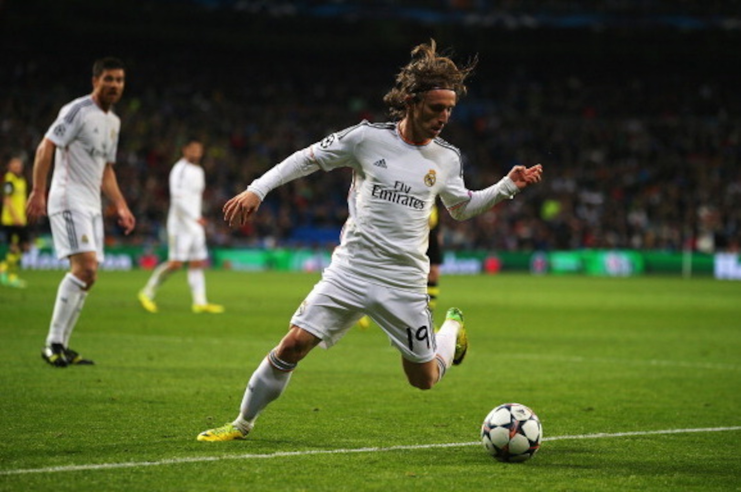 MADRID, SPAIN - APRIL 02: Luka Modric of Real Madrid in action during the UEFA Champions League Quarter Final first leg match between Real Madrid and Borussia Dortmund at Estadio Santiago Bernabeu on April 2, 2014 in Madrid, Spain.  (Photo by Clive Rose/G
