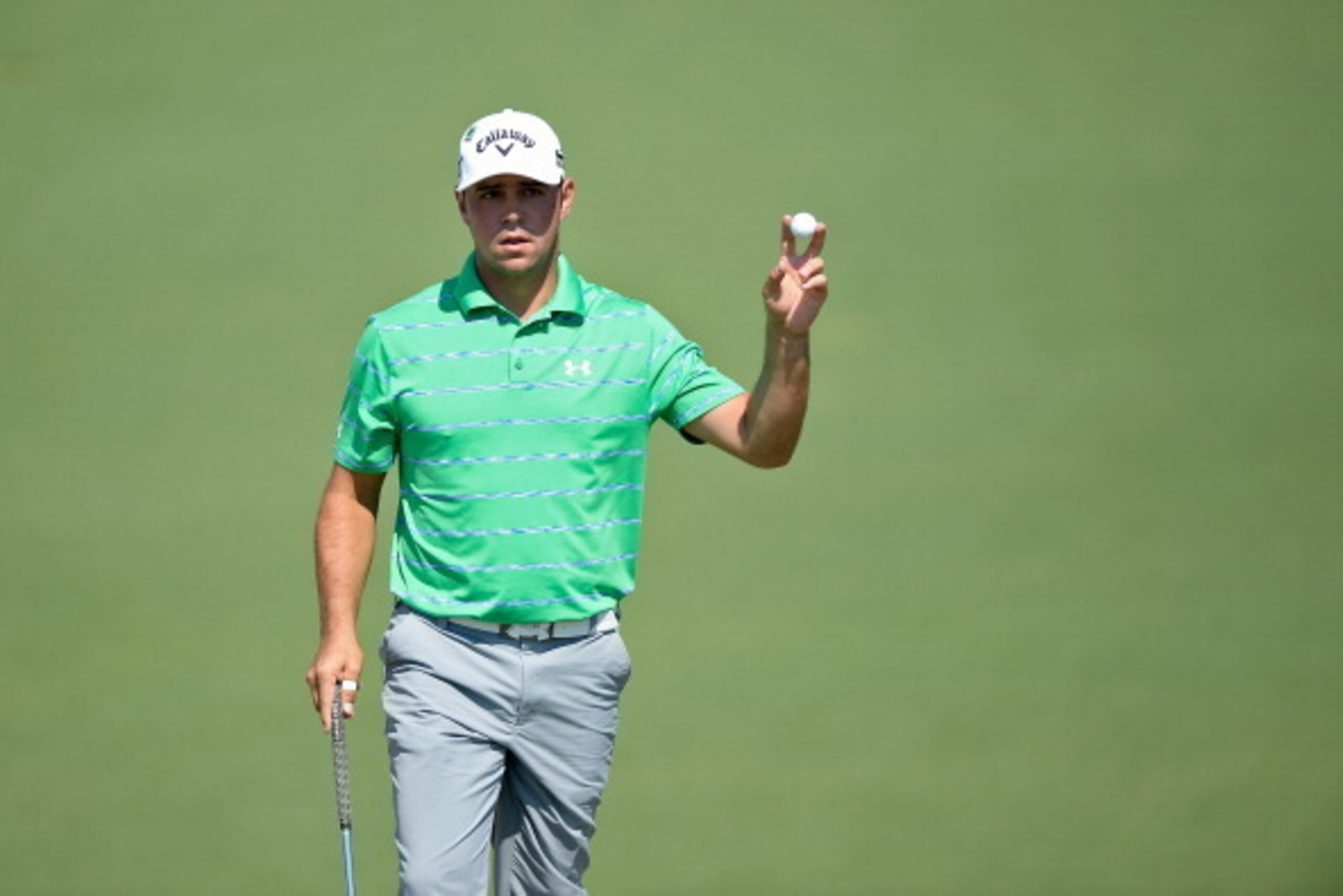 AUGUSTA, GA - APRIL 12:  Gary Woodland of the United States makes eagle on the second hole during the third round of the 2014 Masters Tournament at Augusta National Golf Club on April 12, 2014 in Augusta, Georgia.  (Photo by Harry How/Getty Images)