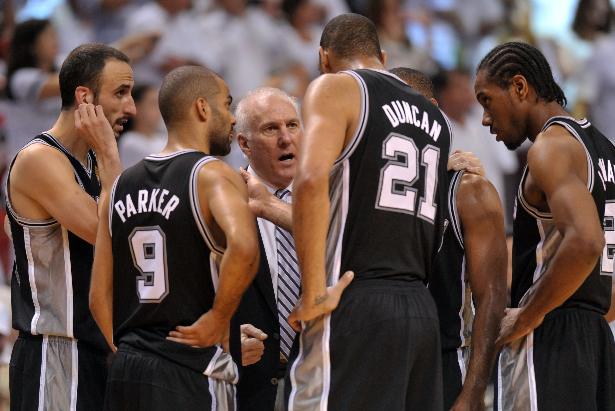 Jun 20, 2013; Miami, FL, USA; San Antonio Spurs head coach Gregg Popovich talks with San Antonio Spurs power forward Tim Duncan (21), point guard Tony Parker (9), and shooting guard Manu Ginobili (left) during the fourth quarter of game seven in the 2013