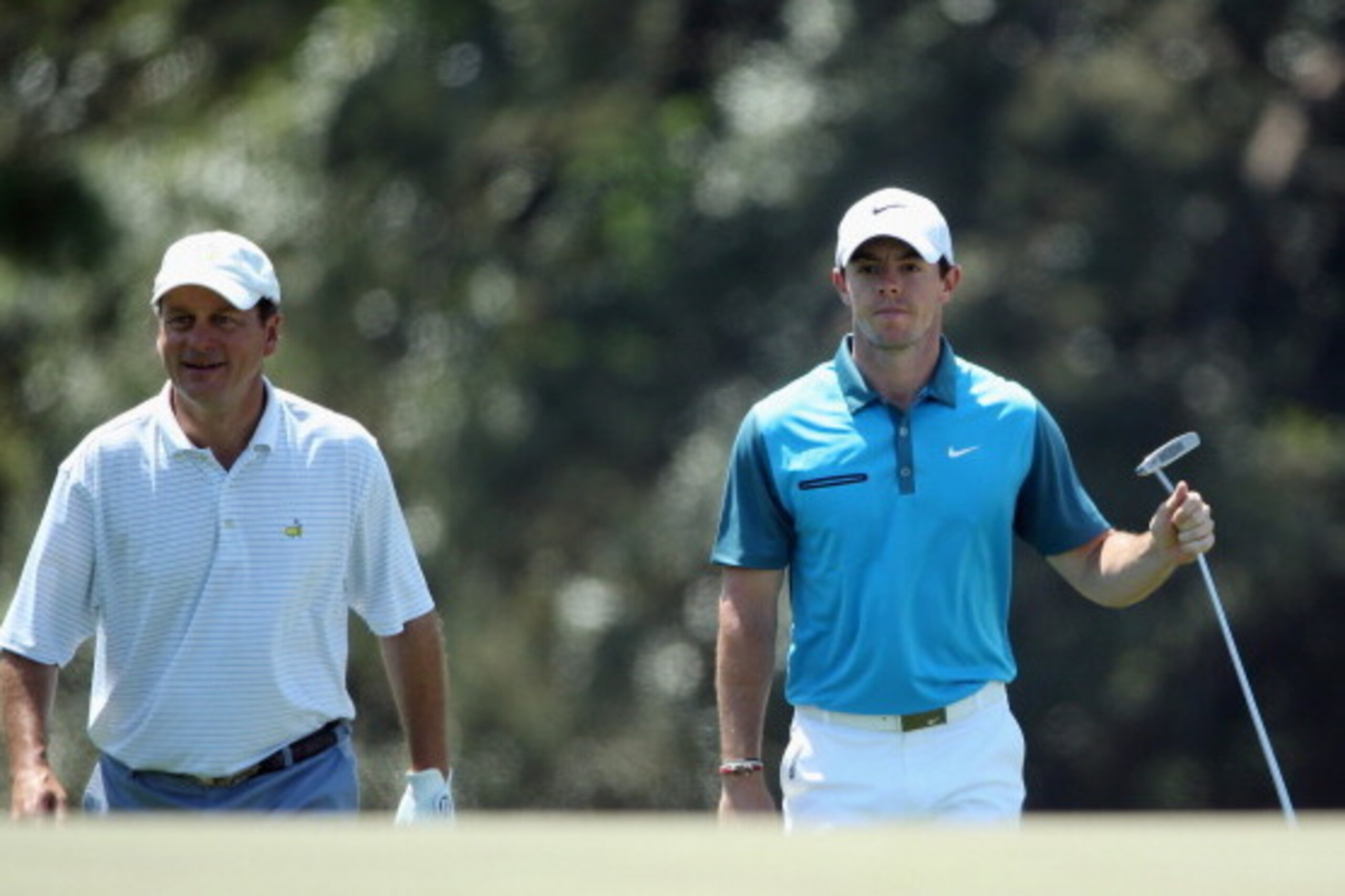 AUGUSTA, GA - APRIL 12:  Marker Jeff Knox and Rory McIlroy of Northern Ireland walk to the 18th green during the third round of the 2014 Masters Tournament at Augusta National Golf Club on April 12, 2014 in Augusta, Georgia.  (Photo by Andrew Redington/Ge