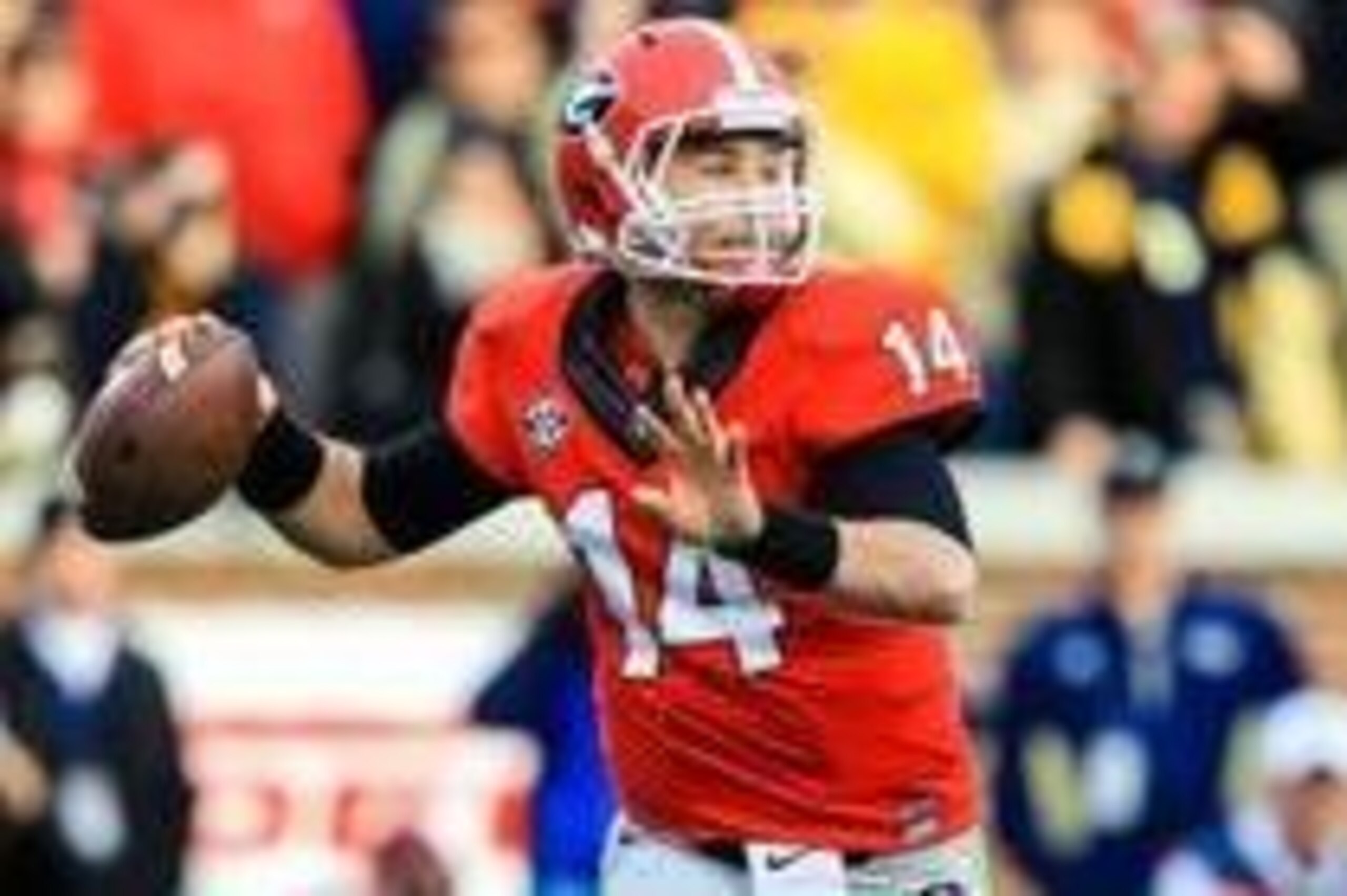 Nov 30, 2013; Atlanta, GA, USA; Georgia Bulldogs quarterback Hutson Mason (14) rolls out on a  pass play in the first half against the Georgia Tech Yellow Jackets at Bobby Dodd Stadium. Mandatory Credit: Daniel Shirey-USA TODAY Sports