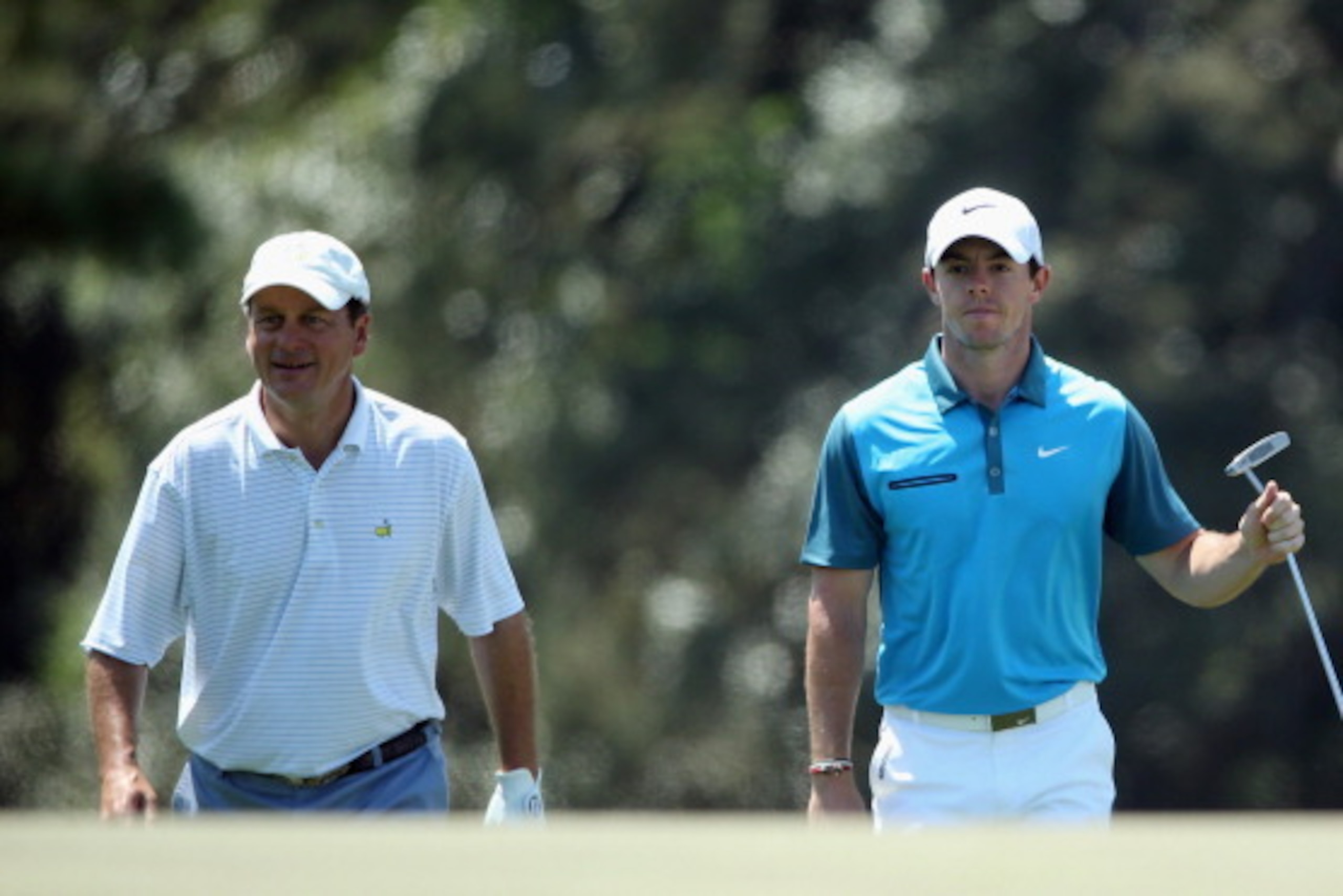 AUGUSTA, GA - APRIL 12:  Marker Jeff Knox and Rory McIlroy of Northern Ireland walk to the 18th green during the third round of the 2014 Masters Tournament at Augusta National Golf Club on April 12, 2014 in Augusta, Georgia.  (Photo by Andrew Redington/Ge