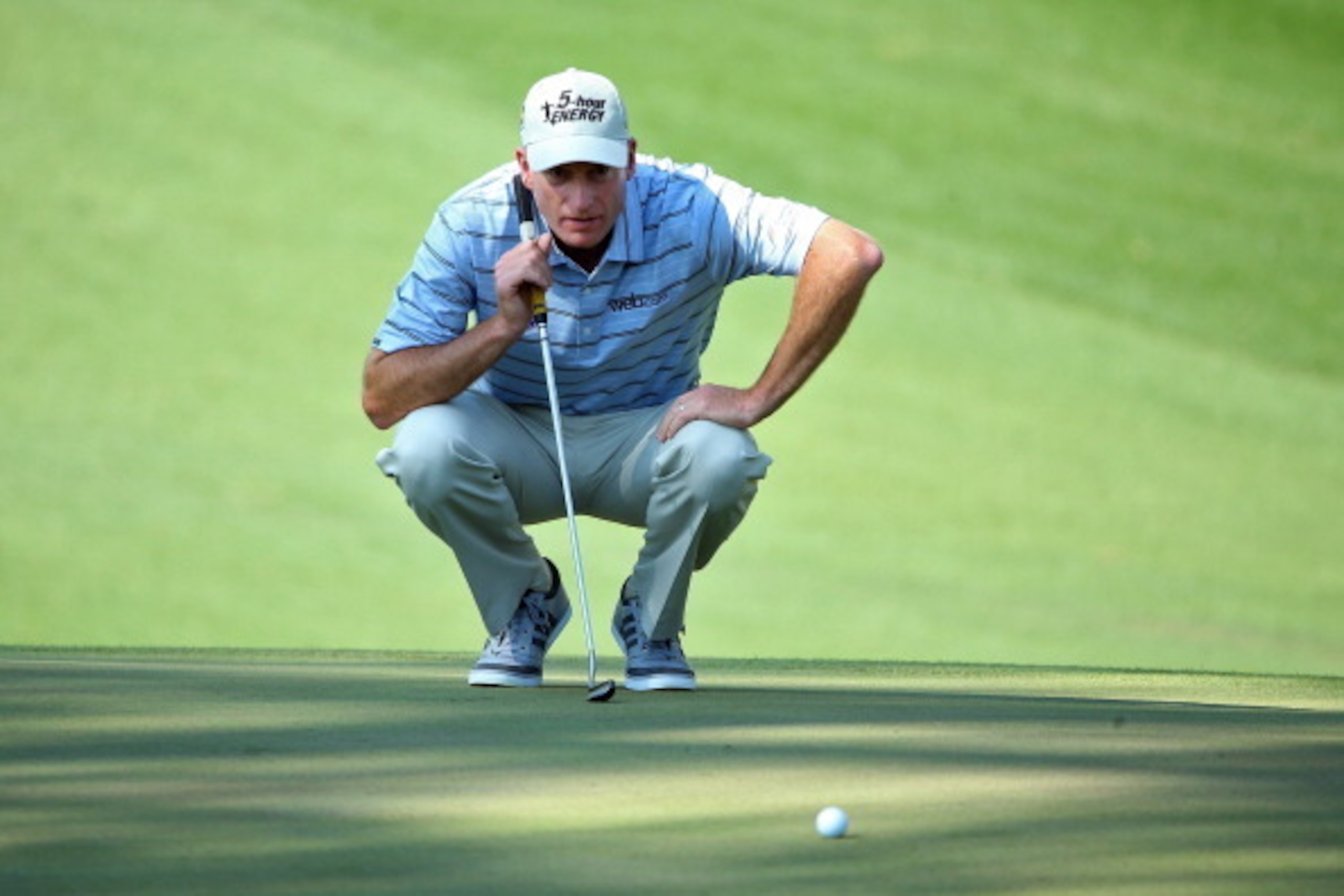 AUGUSTA, GA - APRIL 12:  Jim Furyk of the United States lines up a putt on the tenth green during the third round of the 2014 Masters Tournament at Augusta National Golf Club on April 12, 2014 in Augusta, Georgia.  (Photo by Andrew Redington/Getty Images)