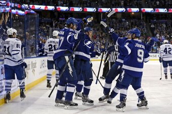 TAMPA, FL - APRIL 8:  Members of the Tampa Bay Lightning (L-R) Victor Hedman #77, Ondrej Palat; Steven Stamkos #91, and Tyler Johnson #9 celebrate a goal as members of the Toronto Maple Leafs react at the Tampa Bay Times Forum on April 8, 2014 in Tampa, F