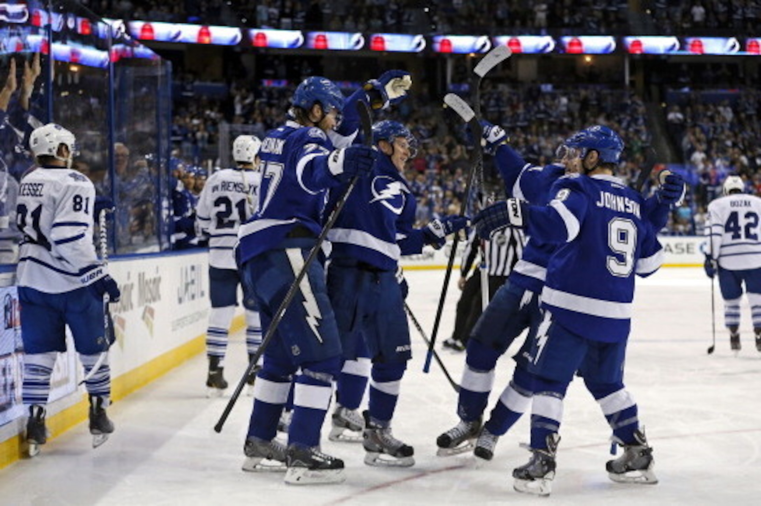 TAMPA, FL - APRIL 8:  Members of the Tampa Bay Lightning (L-R) Victor Hedman #77, Ondrej Palat; Steven Stamkos #91, and Tyler Johnson #9 celebrate a goal as members of the Toronto Maple Leafs react at the Tampa Bay Times Forum on April 8, 2014 in Tampa, F