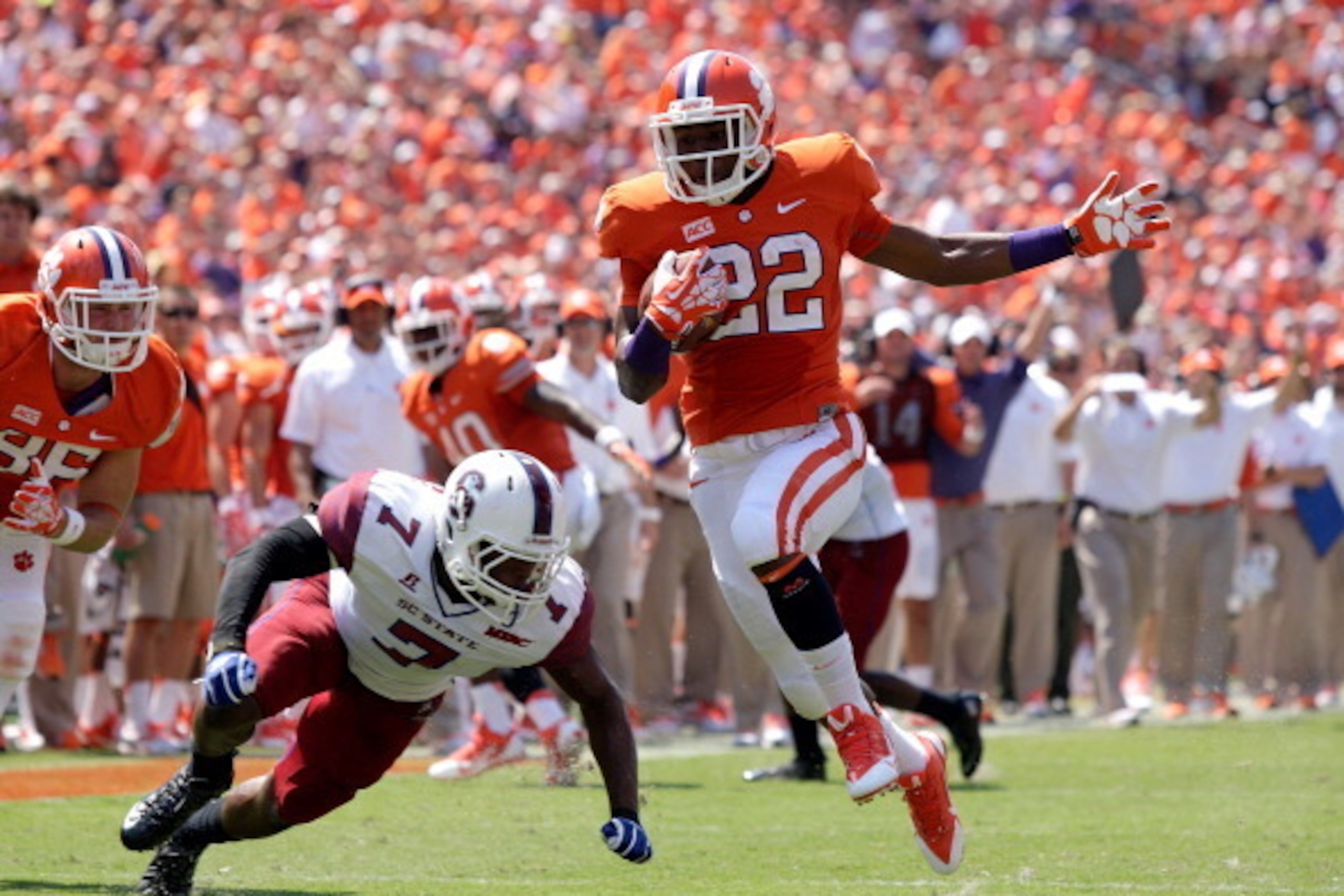 CLEMSON, SC - SEPTEMBER 7: D.J. Howard #22 of the Clemson Tigers rushes for a touchdown during the game against the South Carolina State Bulldogs at Memorial Stadium on September 7, 2013 in Clemson, South Carolina. (Photo by Tyler Smith/Getty Images)