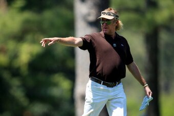 AUGUSTA, GA - APRIL 12:  Miguel Angel Jimenez of Spain waits in the 14th fairway during the third round of the 2014 Masters Tournament at Augusta National Golf Club on April 12, 2014 in Augusta, Georgia.  (Photo by David Cannon/Getty Images)
