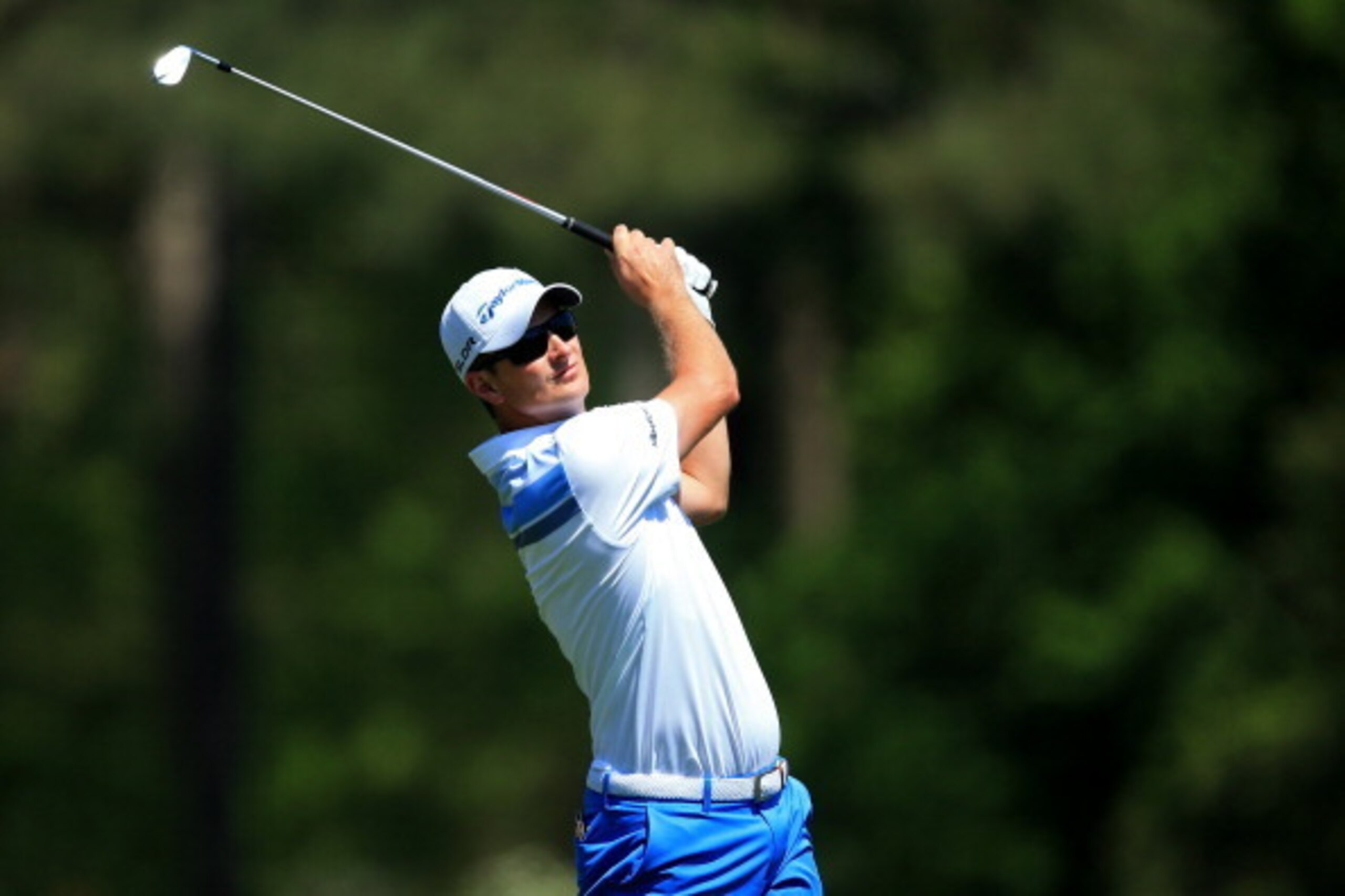 AUGUSTA, GA - APRIL 12:  Justin Rose of England hits his tee shot on the 12th hole during the third round of the 2014 Masters Tournament at Augusta National Golf Club on April 12, 2014 in Augusta, Georgia.  (Photo by David Cannon/Getty Images)
