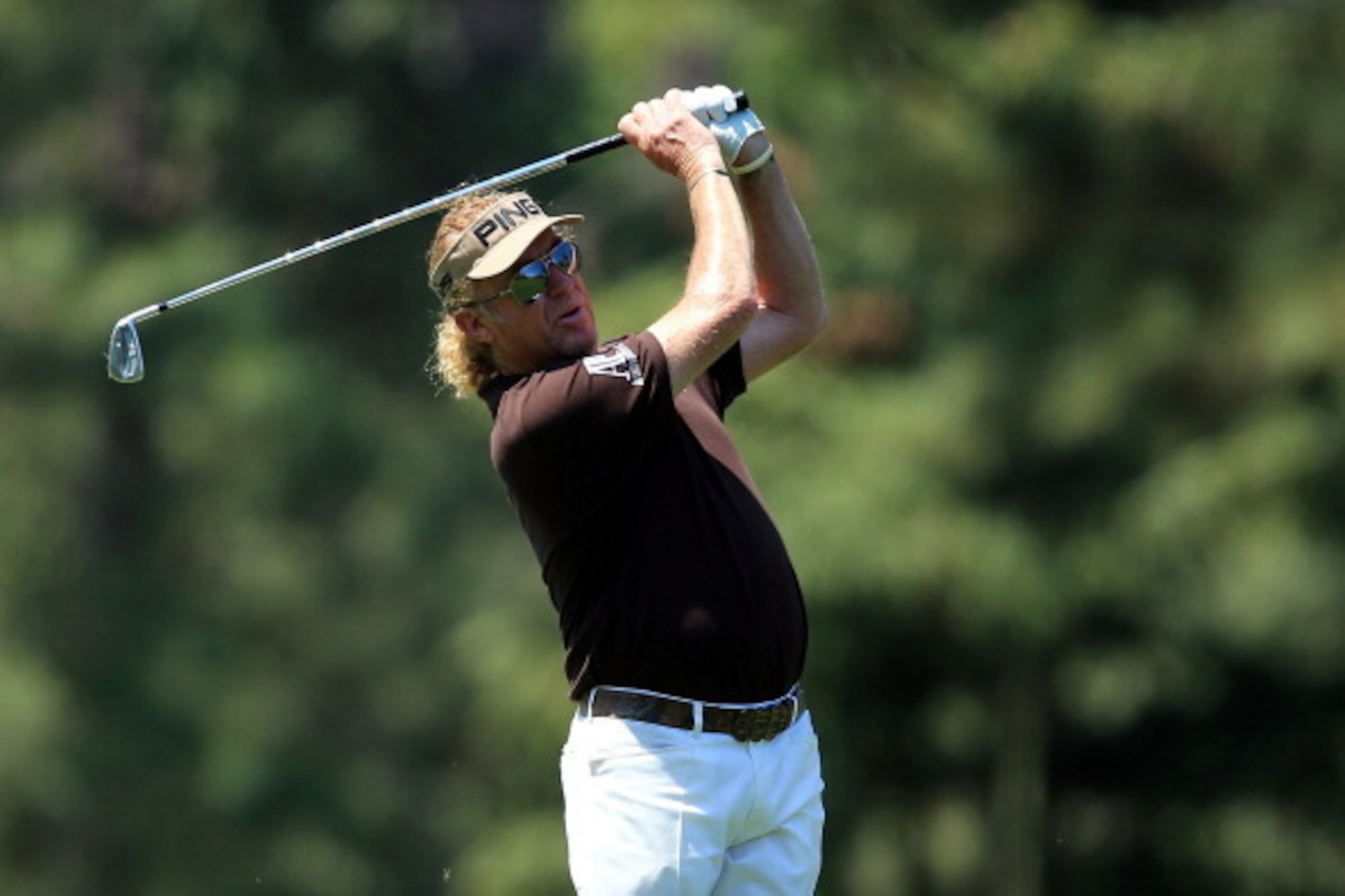 AUGUSTA, GA - APRIL 12:  Miguel Angel Jimenez of Spain watches his approach shot on the 14th fairway during the third round of the 2014 Masters Tournament at Augusta National Golf Club on April 12, 2014 in Augusta, Georgia.  (Photo by David Cannon/Getty I
