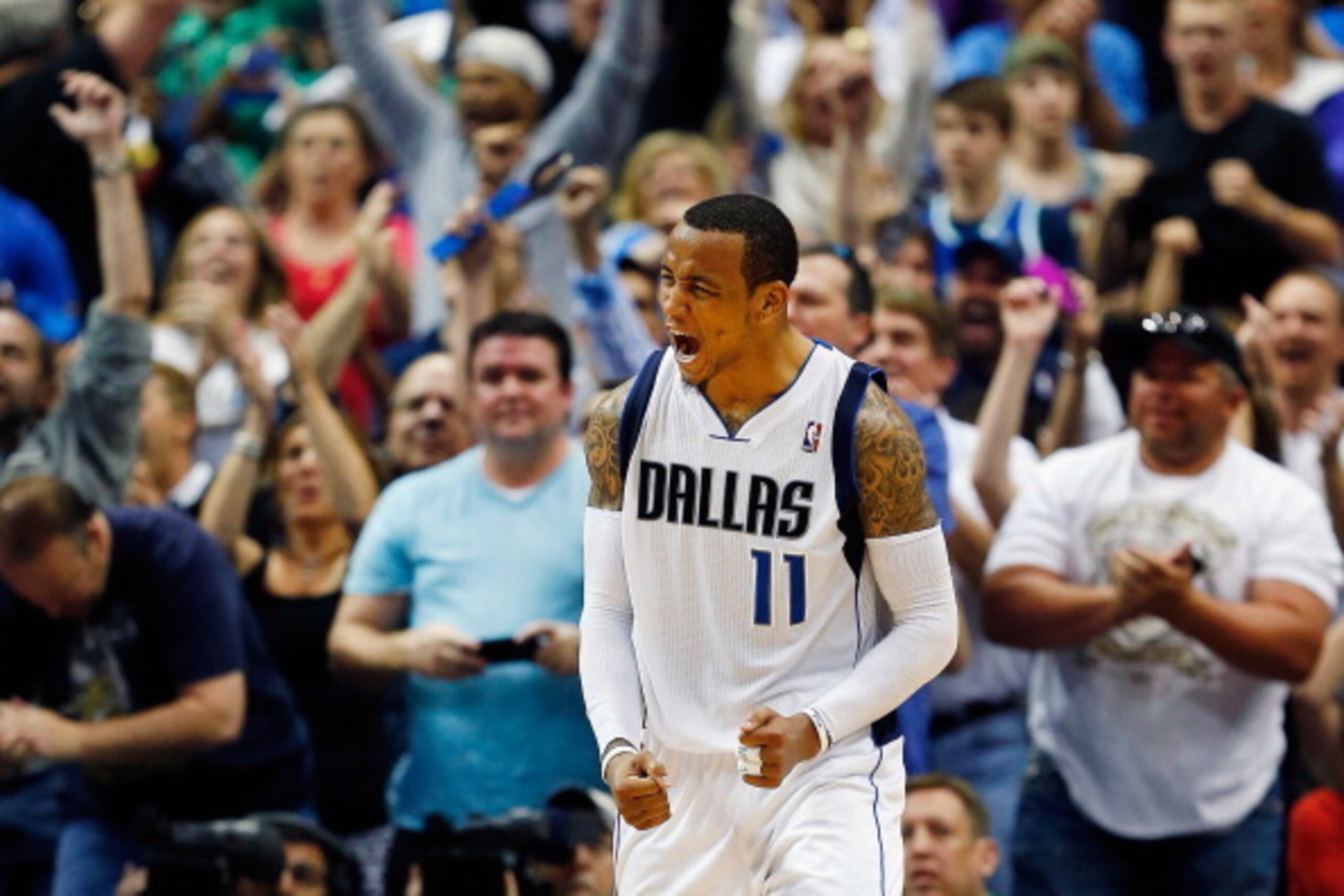 DALLAS, TX - APRIL 12:  Monta Ellis #11 of the Dallas Mavericks reacts after scoring against the Phoenix Suns in the third quarter at American Airlines Center on April 12, 2014 in Dallas, Texas.  (Photo by Tom Pennington/Getty Images)