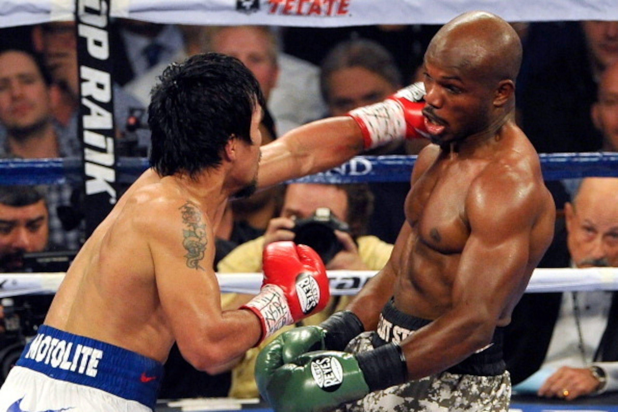 LAS VEGAS, NV - APRIL 12:  Manny Pacquiao (L) and Timothy Bradley battle it out during their WBO world welterweight championship boxing match at the MGM Grand Garden Arena on April 12, 2014 in Las Vegas, Nevada. Pacquiao won by unanimous decision.  (Photo