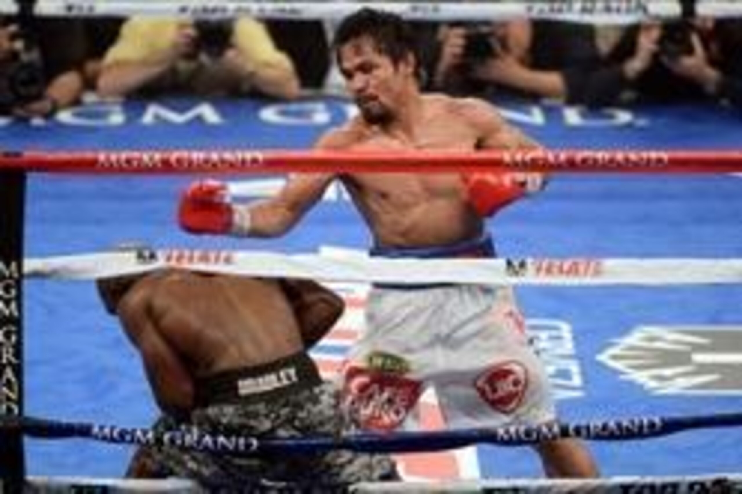 Apr 12, 2014; Las Vegas, NV, USA; Timothy Bradley (green gloves) and Manny Pacquiao (red gloves) box during their WBO World Welterweight Title bout at MGM Grand Garden Arena. Pacquiao won via unanimous decision. Mandatory Credit: Joe Camporeale-USA TODAY 