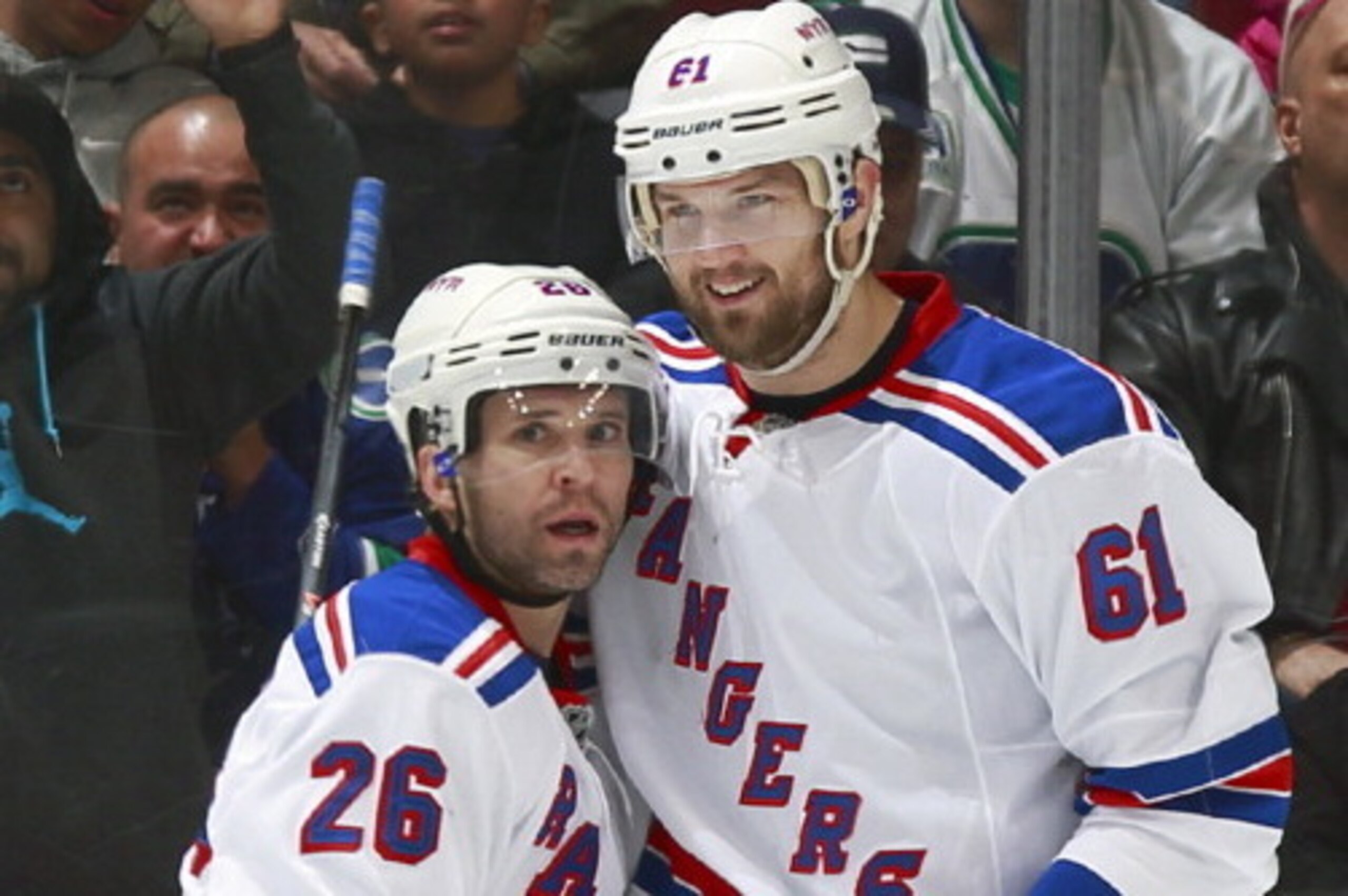 VANCOUVER, BC - APRIL 1: Rick Nash #61 congratulates Martin St. Louis #26 who scored his first goal as a member of the New York Rangers against the Vancouver Canucks during their NHL game at Rogers Arena April 1, 2014 in Vancouver, British Columbia, Canad VANCOUVER, BC - APRIL 1: Rick Nash #61 congratulates Martin St. Louis #26 who scored his first goal as a member of the New York Rangers against the Vancouver Canucks during their NHL game at Rogers Arena April 1, 2014 in Vancouver, British Columbia, Canad