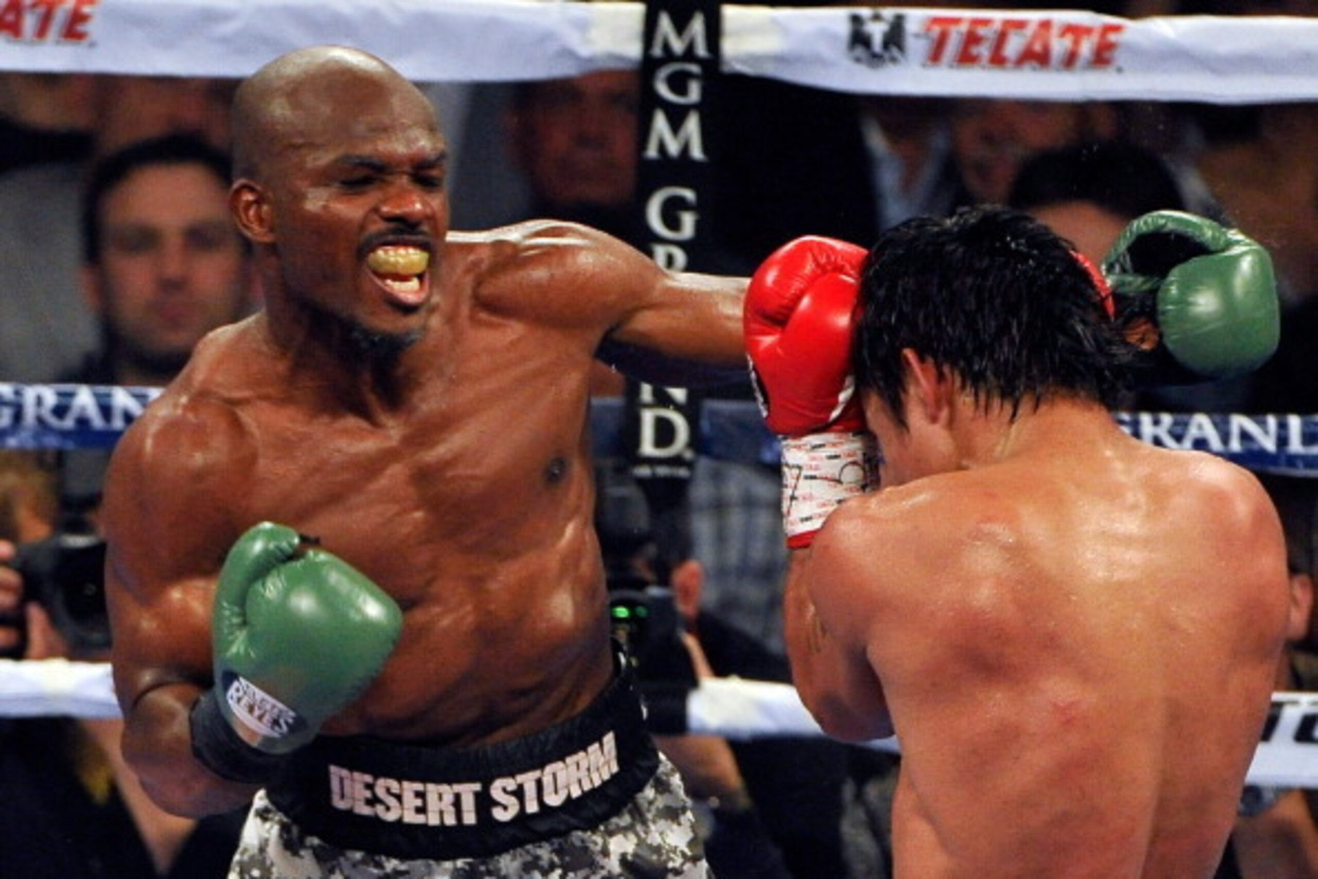 LAS VEGAS, NV - APRIL 12:  Timothy Bradley (L) punches Manny Pacquiao during their WBO world welterweight championship boxing match at the MGM Grand Garden Arena on April 12, 2014 in Las Vegas, Nevada. Pacquiao won by unanimous decision.  (Photo by David 