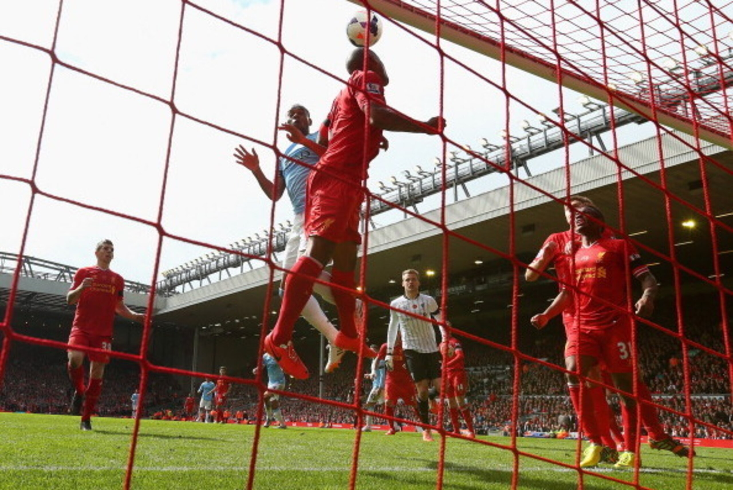 LIVERPOOL, ENGLAND - APRIL 13:  Raheem Sterling and Glen Johnson (L) of Liverpool make a goal-line clearance during the Barclays Premier League match between Liverpool and Manchester City at Anfield on April 13, 2014 in Liverpool, England.  (Photo by Alex