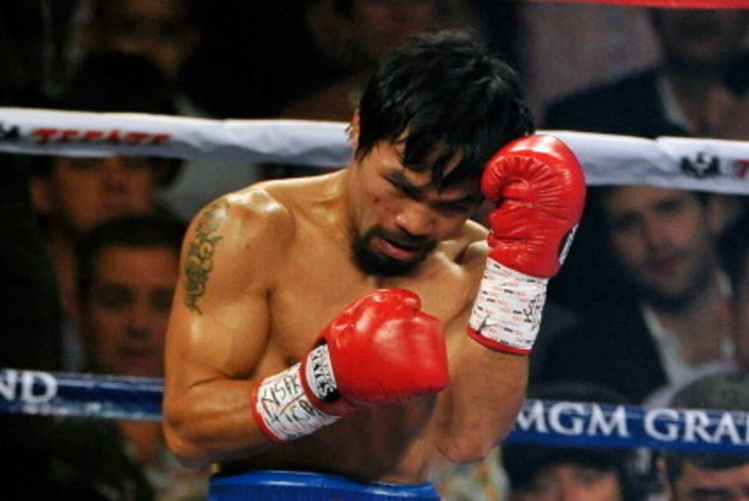 LAS VEGAS, NV - APRIL 12:  Manny Pacquiao (L) and Timothy Bradley fight during their WBO world welterweight championship boxing match at the MGM Grand Garden Arena on April 12, 2014 in Las Vegas, Nevada.  (Photo by David Becker/Getty Images)