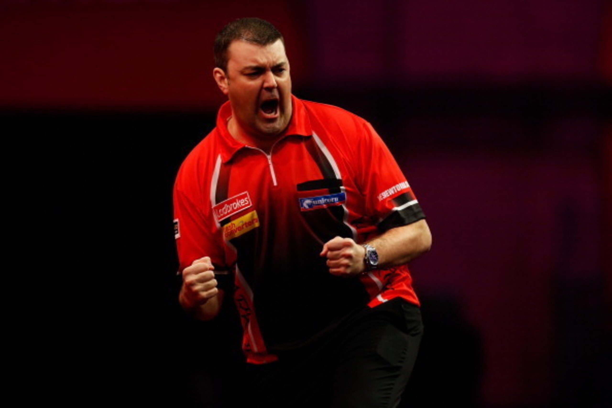 LONDON, ENGLAND - DECEMBER 27:  Wes Newton of England celebrates winning a set during his third round match against Robert Thornton of Scotland on day twelve of the Ladbrokes.com World Darts Championship at Alexandra Palace on December 27, 2013 in London,