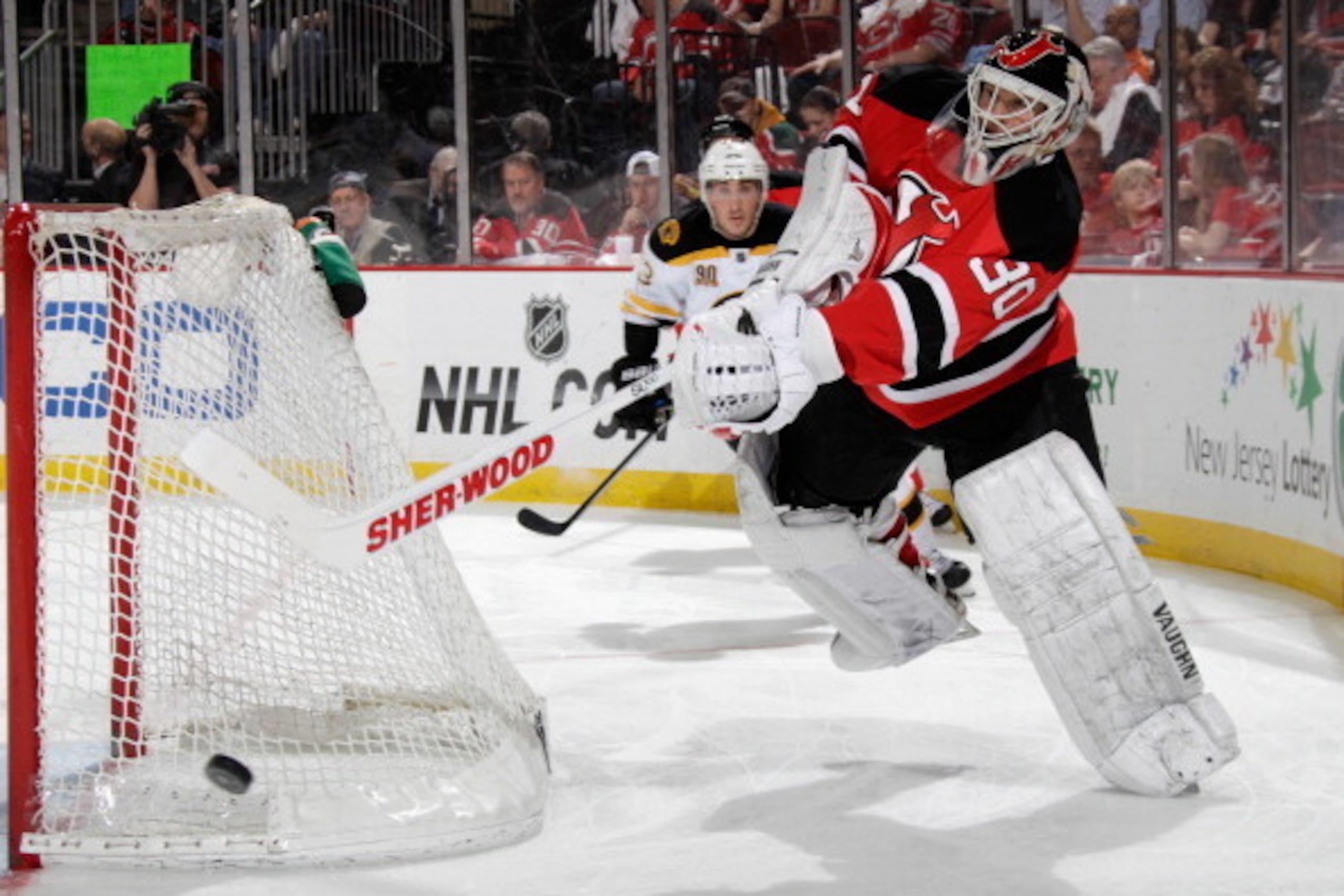 NEWARK, NJ - APRIL 13: Martin Brodeur #30 of the New Jersey Devils shoots the puck away from the net during the third period against the Boston Bruins at the Prudential Center on April 13, 2014 in Newark, New Jersey. The Devils defeated the Bruins 3-2. (P