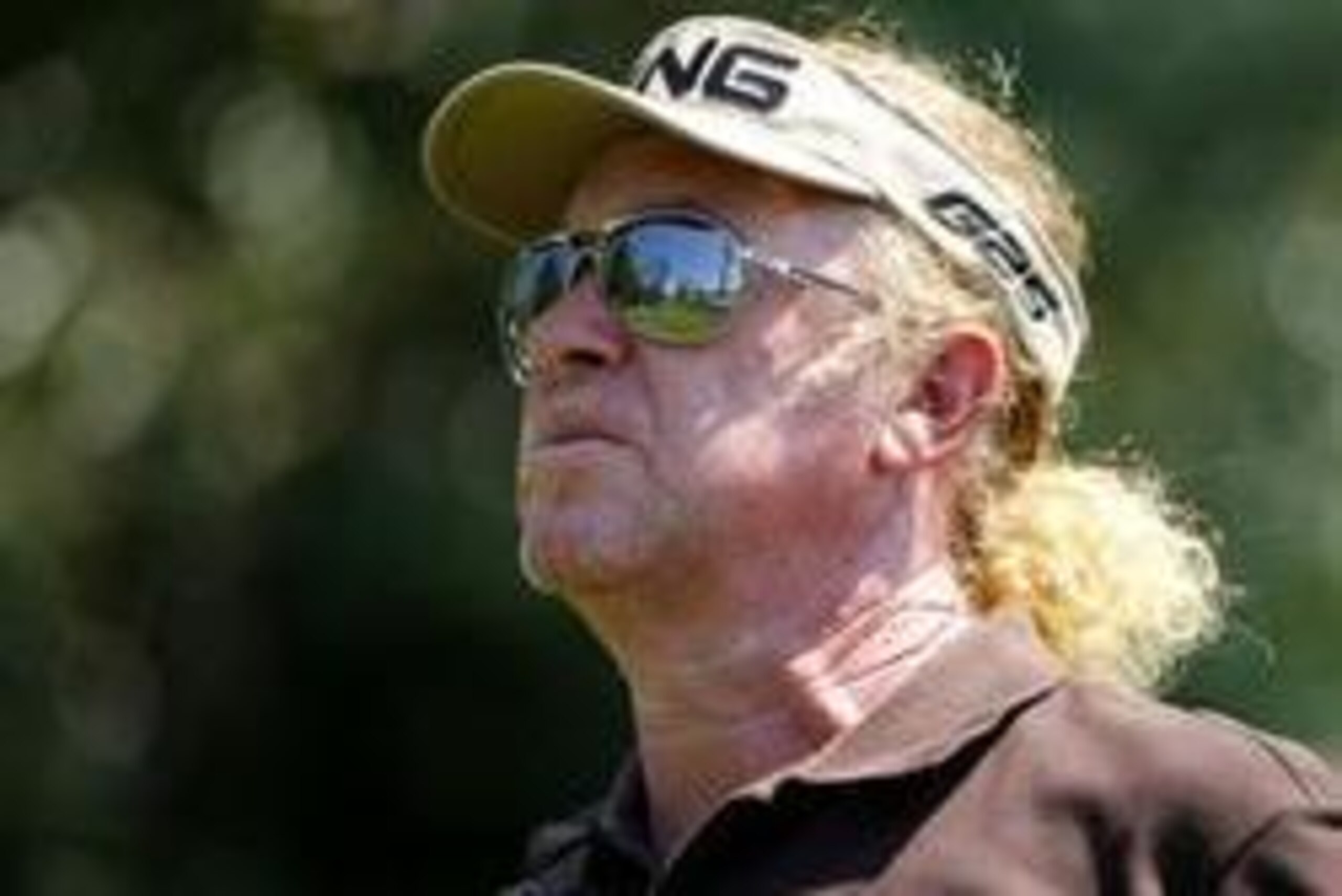 Apr 12, 2014; Augusta, GA, USA; Miguel Angel Jimenez watches his tee shot on the 18th hole during the third round of the 2014 The Masters golf tournament at Augusta National Golf Club. Mandatory Credit: Jack Gruber-USA TODAY Sports