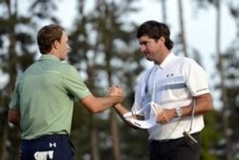 Apr 13, 2014; Augusta, GA, USA; Bubba Watson (right) greets Jordan Spieth (left) after winning the 2014 The Masters golf tournament at Augusta National Golf Club. Mandatory Credit: Jack Gruber-USA TODAY Sports