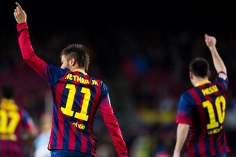 BARCELONA, SPAIN - MARCH 26: Neymar Santos Jr (L) and Lionel Messi of FC Barcelona celebrate after Neymar Santos Jr scored the opening goal during the La Liga match between FC Barcelona and RC Celta de Vigo at Camp Nou on March 26, 2014 in Barcelona, Spai