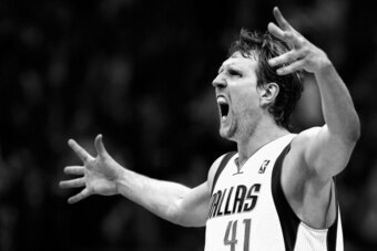 DALLAS, TX - APRIL 12:   (EDITORS NOTE: Image has been converted to black and white.) Dirk Nowitzki #41 of the Dallas Mavericks reacts after making a three point shot against the Phoenix Suns in the third quarter at American Airlines Center on April 12, 2