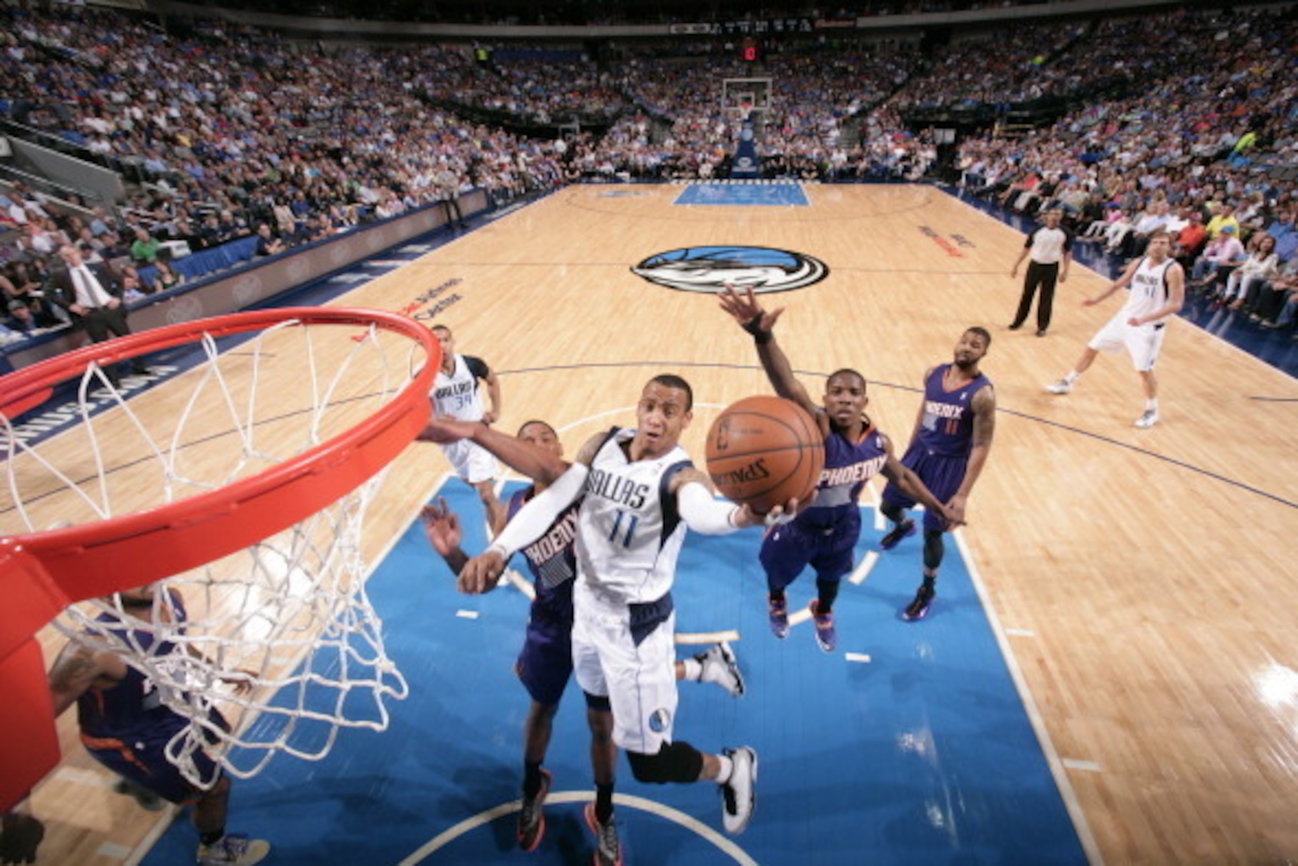 DALLAS, TX - APRIL 12: Monta Ellis #11 of the Dallas Mavericks shoots against the Phoenix Suns on April 12, 2014 at the American Airlines Center in Dallas, Texas. NOTE TO USER: User expressly acknowledges and agrees that, by downloading and or using this 