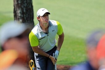 AUGUSTA, GA - APRIL 13:  Rory McIlroy of Northern Ireland watches a shot from the rough during the final round of the 2014 Masters Tournament at Augusta National Golf Club on April 13, 2014 in Augusta, Georgia.  (Photo by David Cannon/Getty Images)