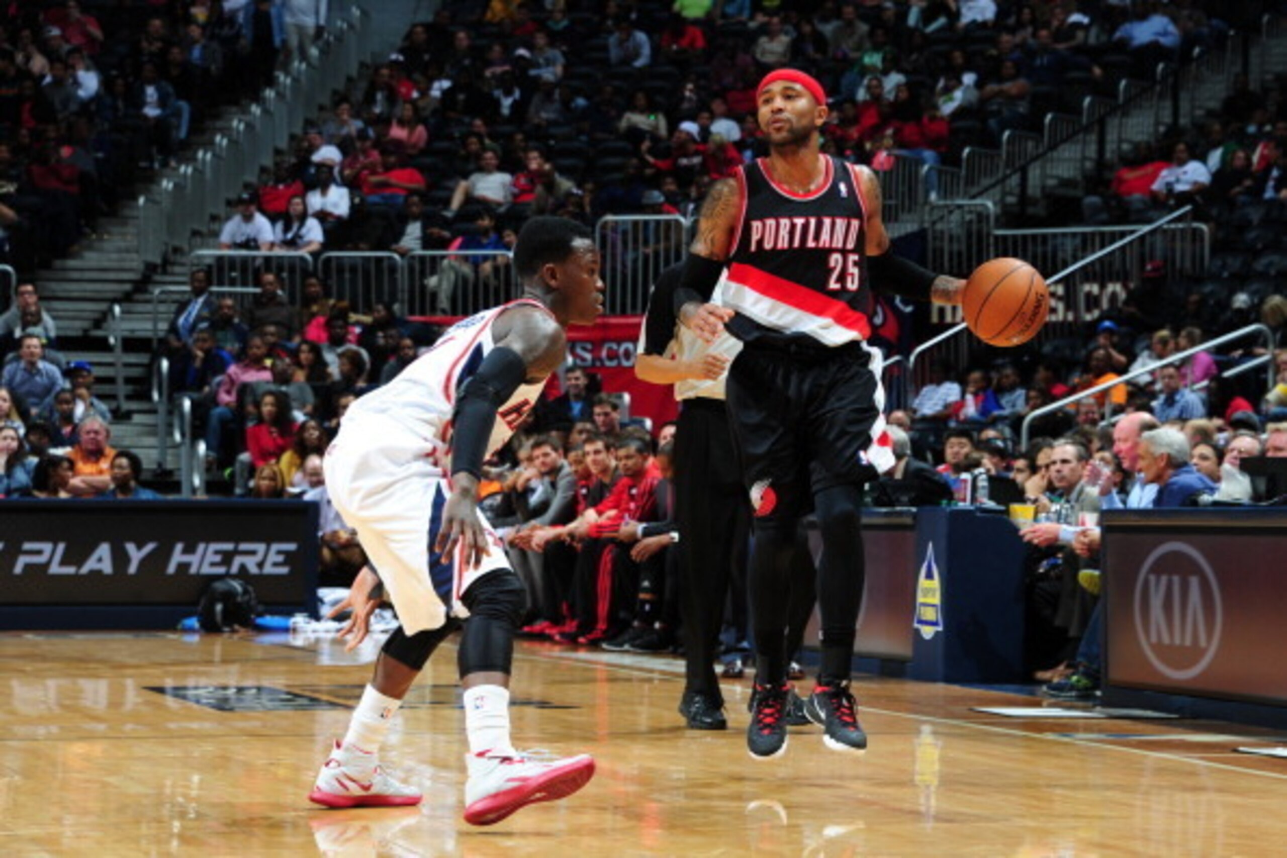 ATLANTA, GA - MARCH 27: Mo Williams #25 of the Portland Trail Blazers handles the ball against Dennis Schroder #17 of the Atlanta Hawks on March 27, 2014 at Philips Arena in Atlanta, Georgia.  NOTE TO USER: User expressly acknowledges and agrees that, by 