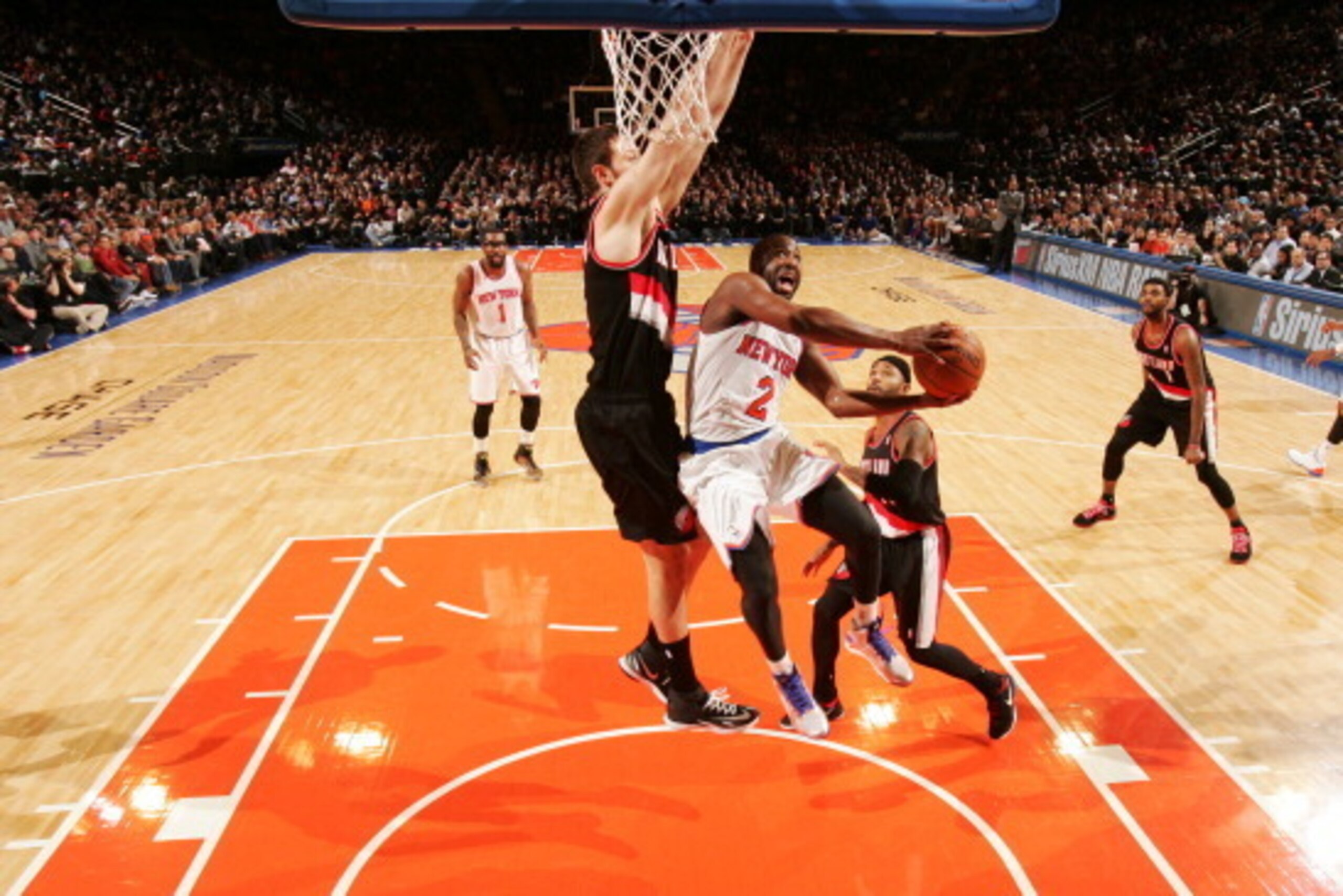 NEW YORK, NY - FEBRUARY 05: Raymond Felton #2 of the New York Knicks shoots against Joel Freeland #19 of the Portland Trail Blazers during a game at Madison Square Garden in New York City on February 05, 2014.  NOTE TO USER: User expressly acknowledges an