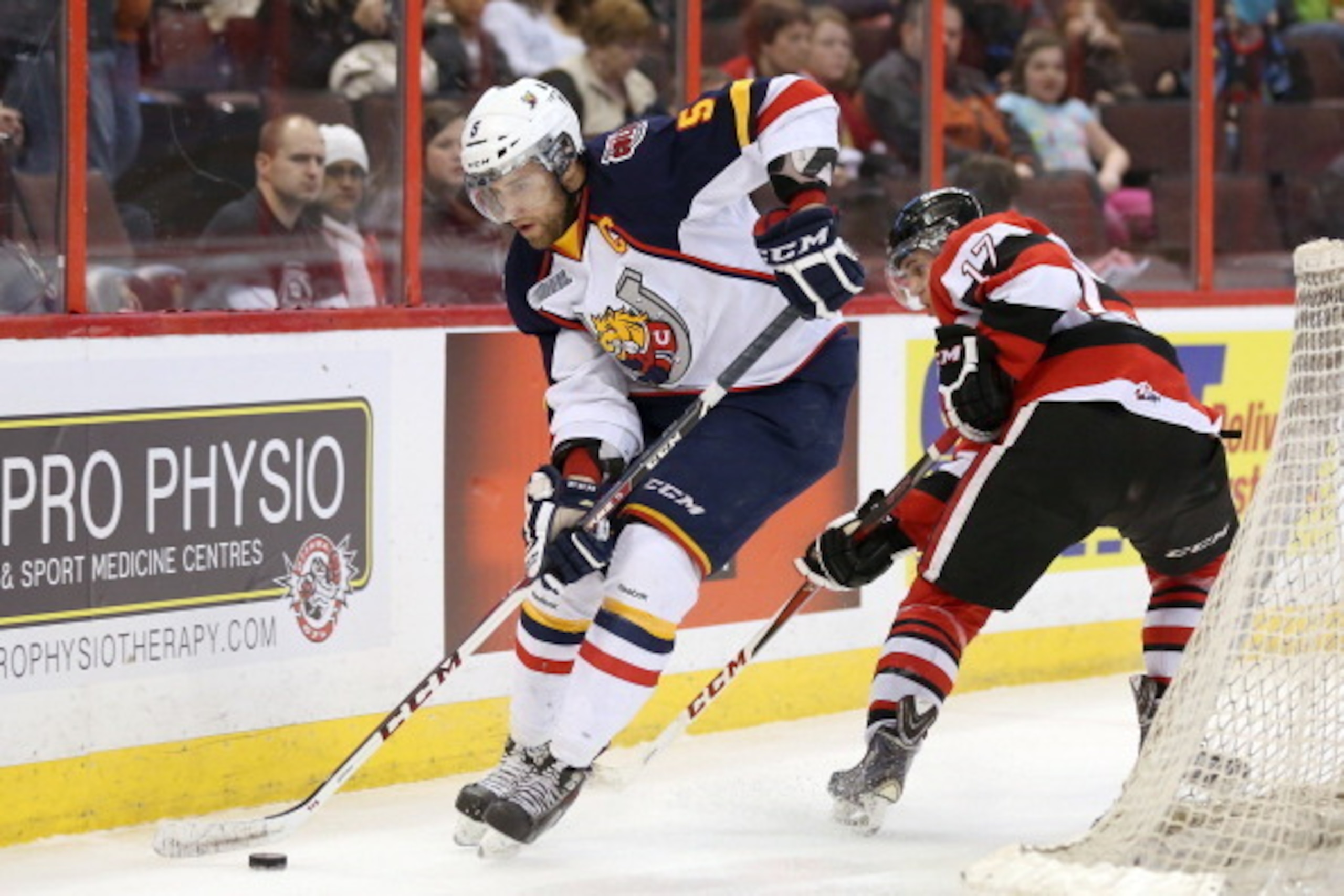 OTTAWA, ON - MARCH 13: Aaron Ekblad #5 of the Barrie Colts skates with the puck past Travis Konecny #17 of the Ottawa 67's during an OHL game at Canadian Tire Centre on March 13, 2014 in Ottawa, Ontario, Canada. (Photo by Jana Chytilova/Freestyle Photog OTTAWA, ON - MARCH 13: Aaron Ekblad #5 of the Barrie Colts skates with the puck past Travis Konecny #17 of the Ottawa 67's during an OHL game at Canadian Tire Centre on March 13, 2014 in Ottawa, Ontario, Canada. (Photo by Jana Chytilova/Freestyle Photog