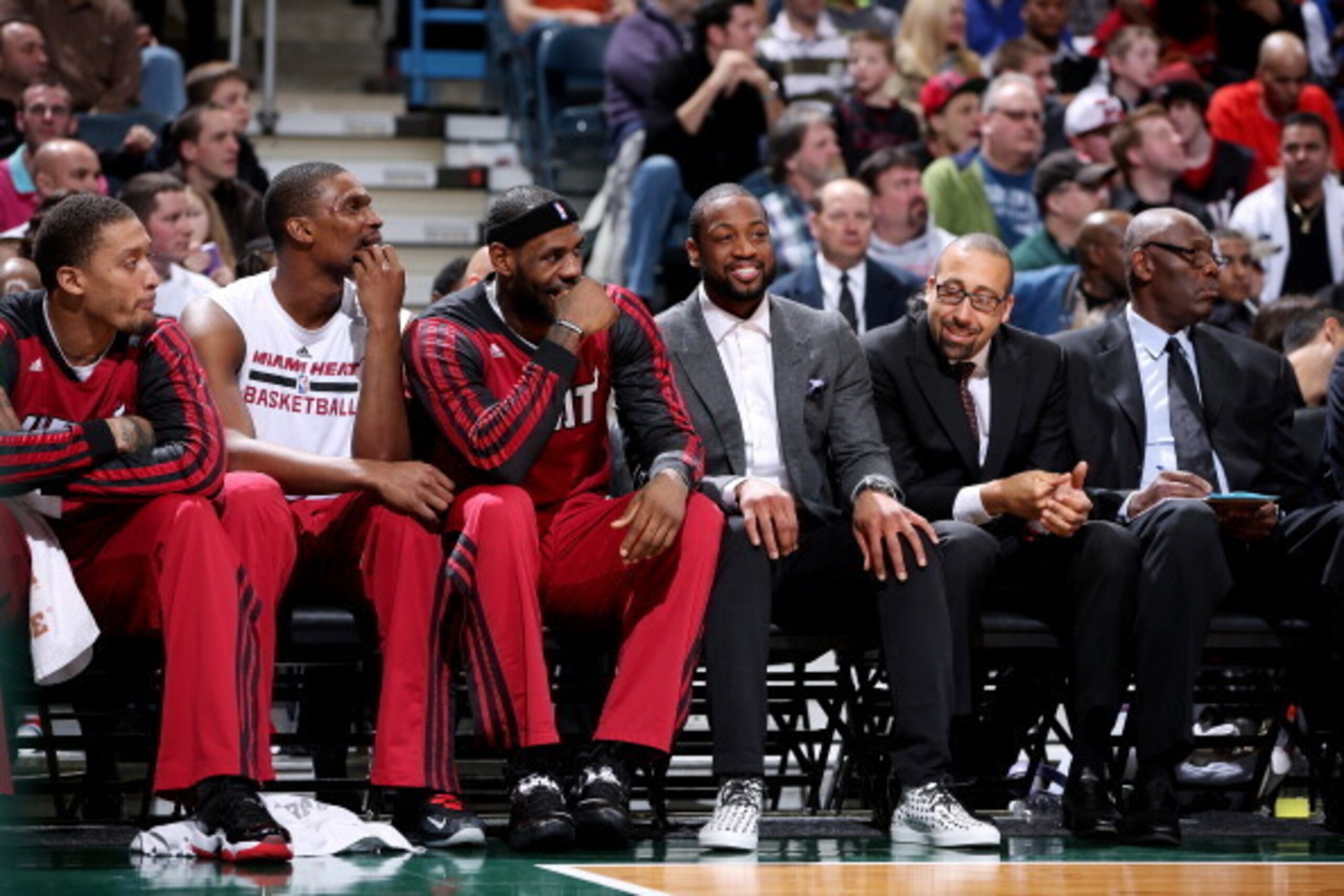 MILWAUKEE, WI - MARCH 29: Michael Beasley #8, Chris Bosh #1, LeBron James #6 and Dwyane Wade #3 of the Miami Heat sit on the bench during the game against the Milwaukee Bucks on March 29, 2014 at the BMO Harris Bradley Center in Milwaukee, Wisconsin. NOTE