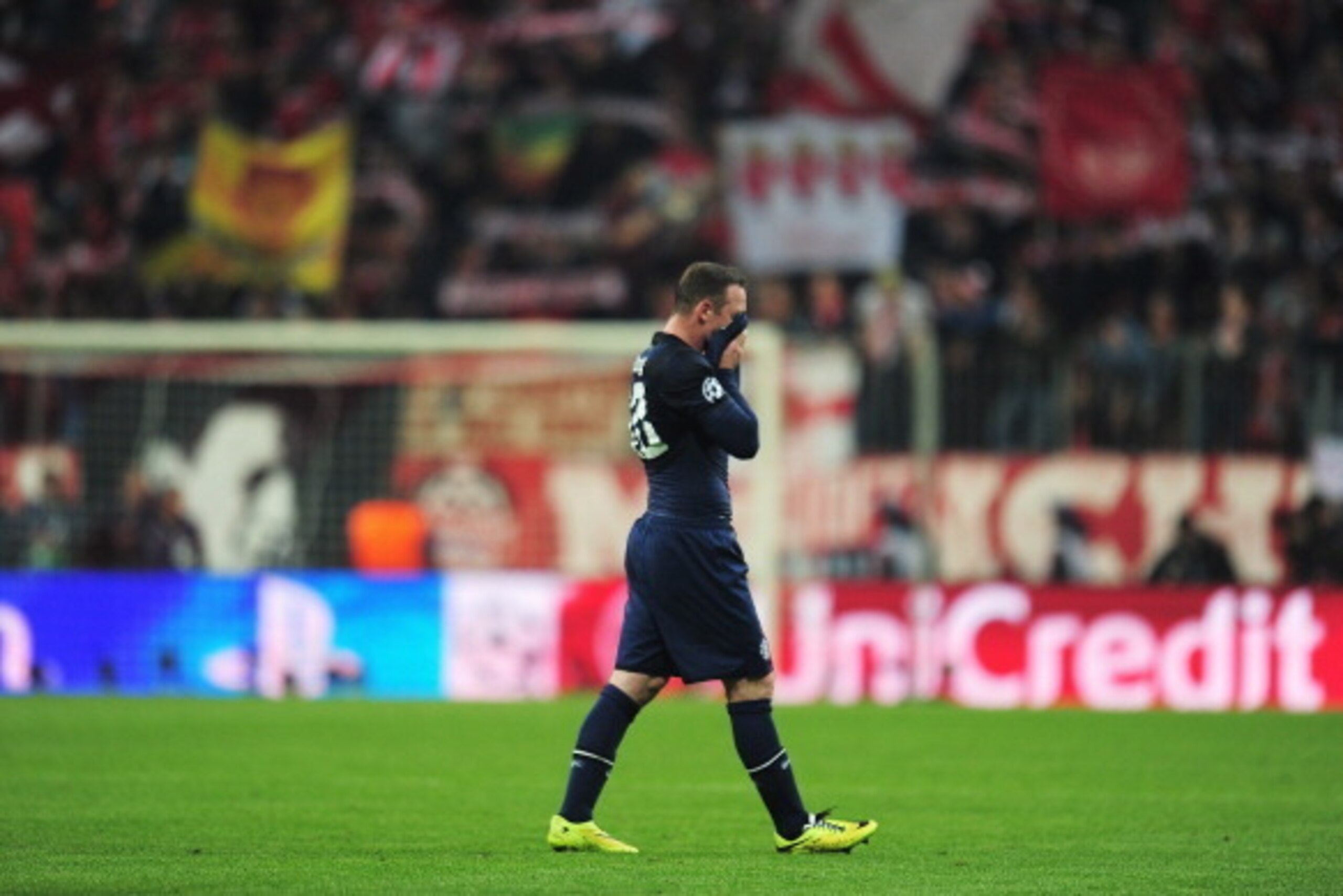 MUNICH, GERMANY - APRIL 09: Wayne Rooney of Manchester United leaves the field dejected after the UEFA Champions League Quarter Final second leg match between FC Bayern Muenchen and Manchester United at Allianz Arena on April 9, 2014 in Munich, Germany. MUNICH, GERMANY - APRIL 09: Wayne Rooney of Manchester United leaves the field dejected after the UEFA Champions League Quarter Final second leg match between FC Bayern Muenchen and Manchester United at Allianz Arena on April 9, 2014 in Munich, Germany.