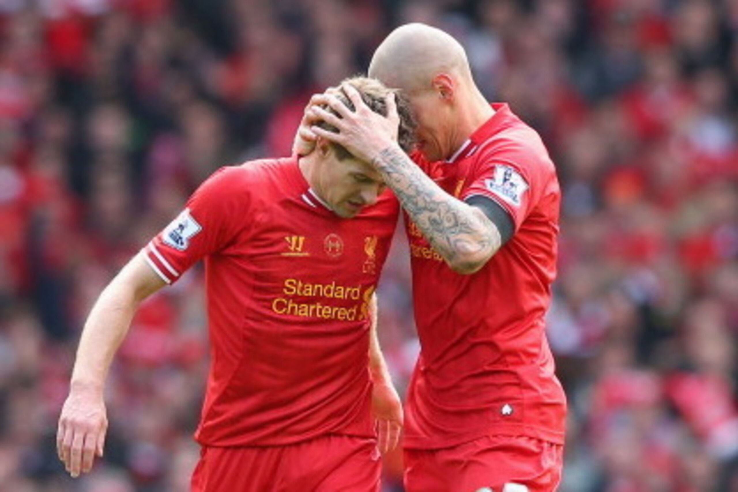 LIVERPOOL, ENGLAND - APRIL 13:  Martin Skrtel of Liverpool celebrates scoring the second goal with team-mate Steven Gerrard (L) during the Barclays Premier League match between Liverpool and Manchester City at Anfield on April 13, 2014 in Liverpool, Engla