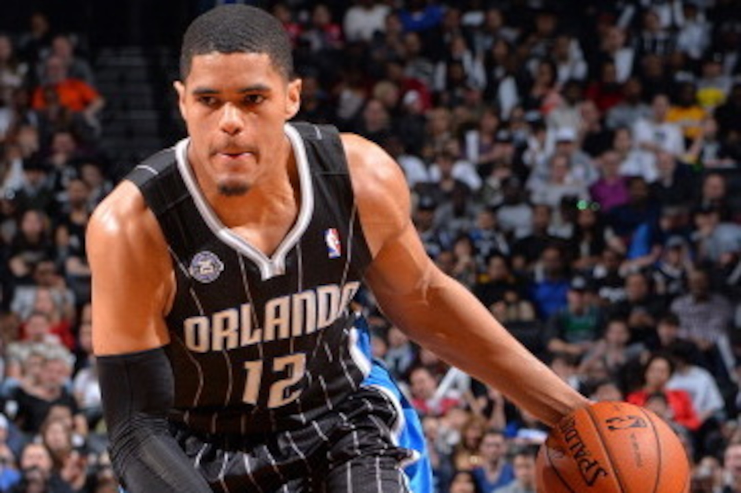 BROOKLYN, NY - APRIL 13: Tobias Harris #12 of the Orlando Magic handles the ball against the Brooklyn Nets on April 13, 2014 at the Barclays Center in Brooklyn, New York. NOTE TO USER: User expressly acknowledges and agrees that, by downloading and or usi