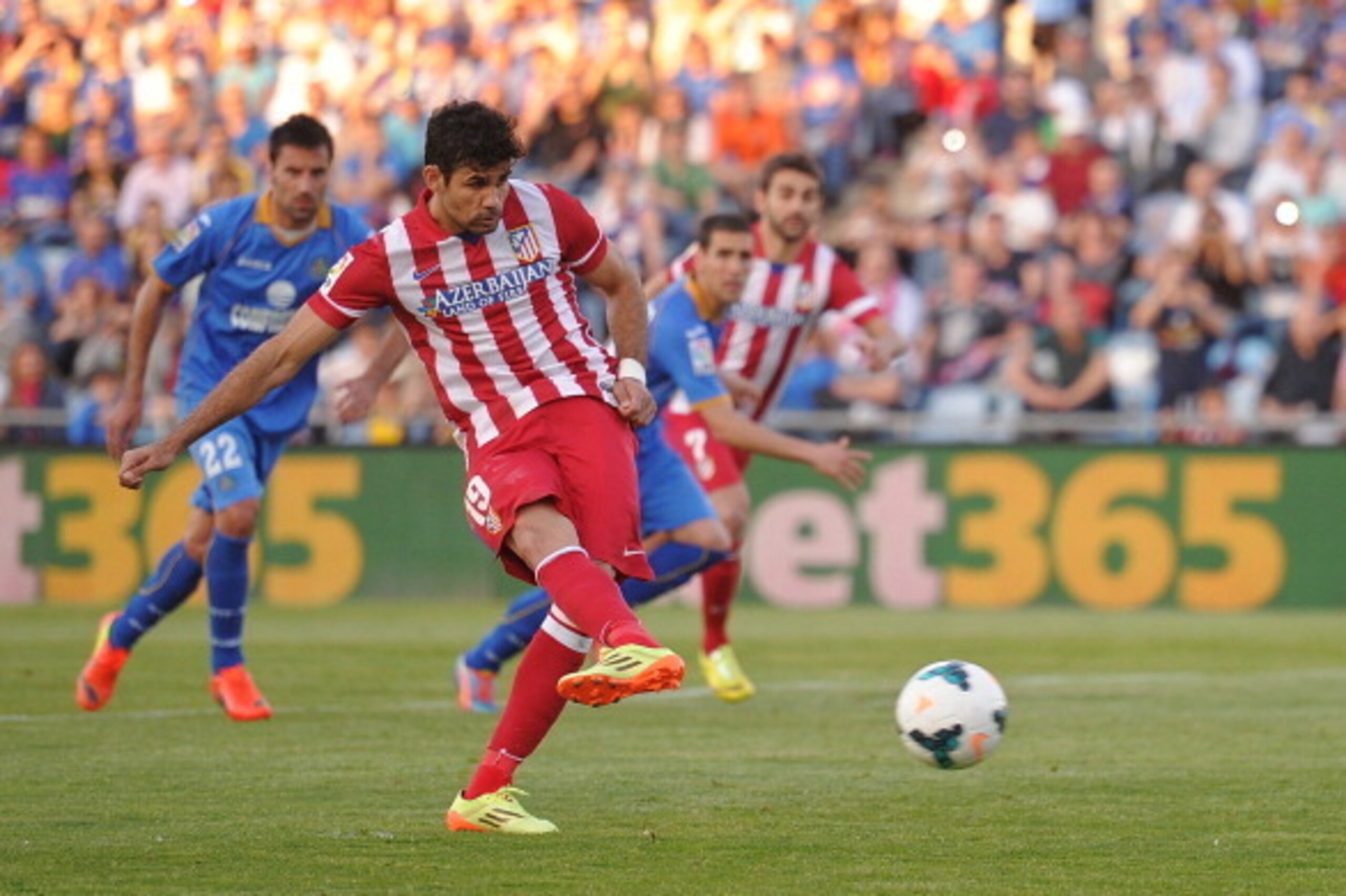 GETAFE, SPAIN - APRIL 13: Diego Costa (#19) of Club Atletico de Madrid takes a penalty kick during the La Liga match between Getafe CF and Club Atletico de Madrid at Coliseum Alfonso Perez stadium on April 13, 2014 in Getafe, Spain. The penalty was saved 