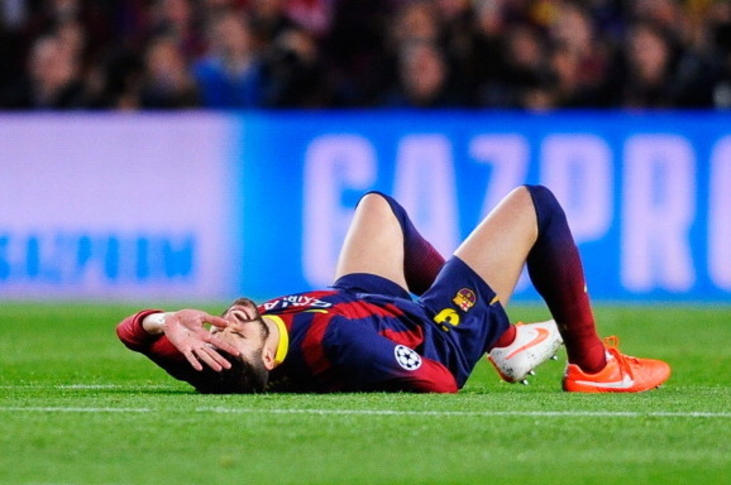 BARCELONA, SPAIN - APRIL 01: Gerard Pique of Barcelona grimaces before being substituted for an injury during the UEFA Champions League Quarter Final first leg match between FC Barcelona and Club Atletico de Madrid at Camp Nou on April 1, 2014 in Barcelon