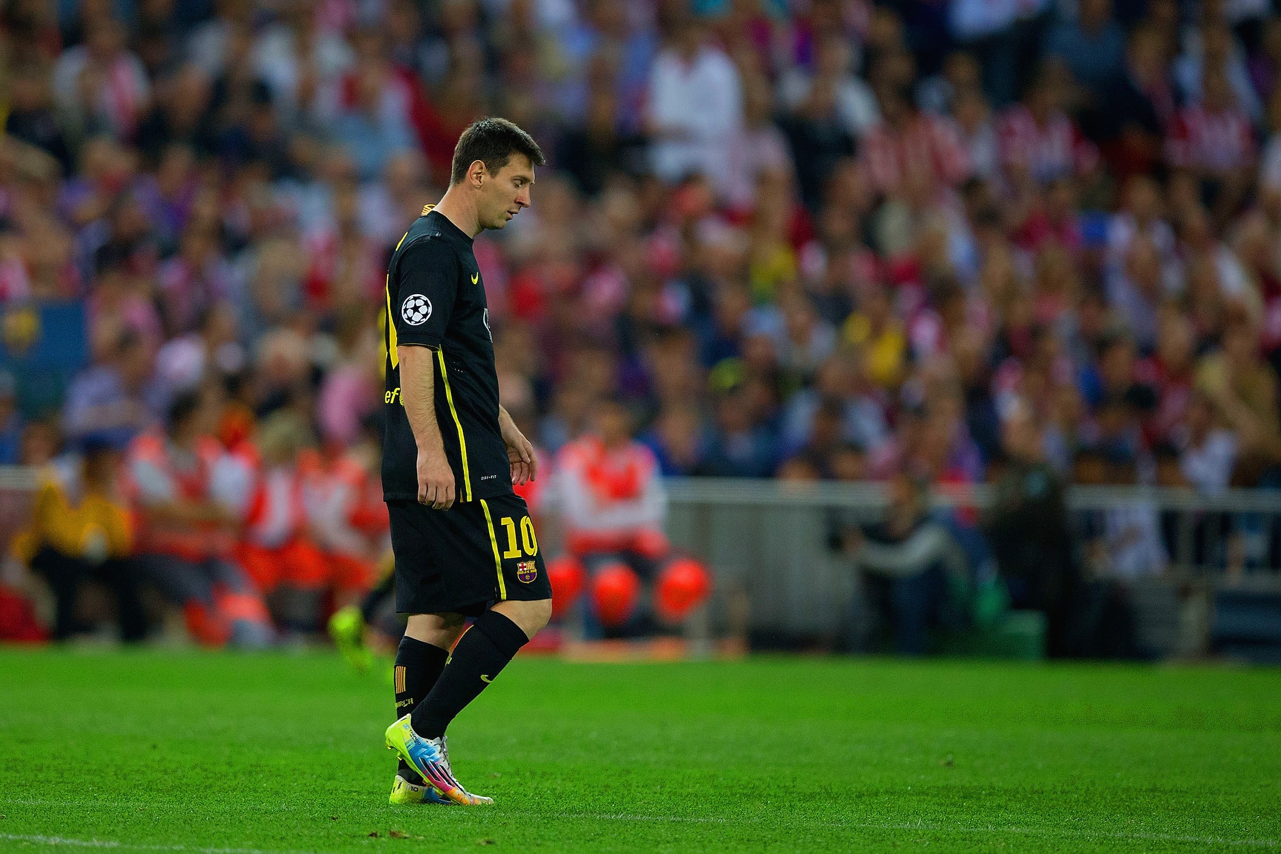 MADRID, SPAIN - APRIL 09:  Lionel Messi of Barcelona leaves the field dejected after defeat during the UEFA Champions League Quarter Final second leg match between Club Atletico de Madrid and FC Barcelona at Vicente Calderon Stadium on April 9, 2014 in Ma