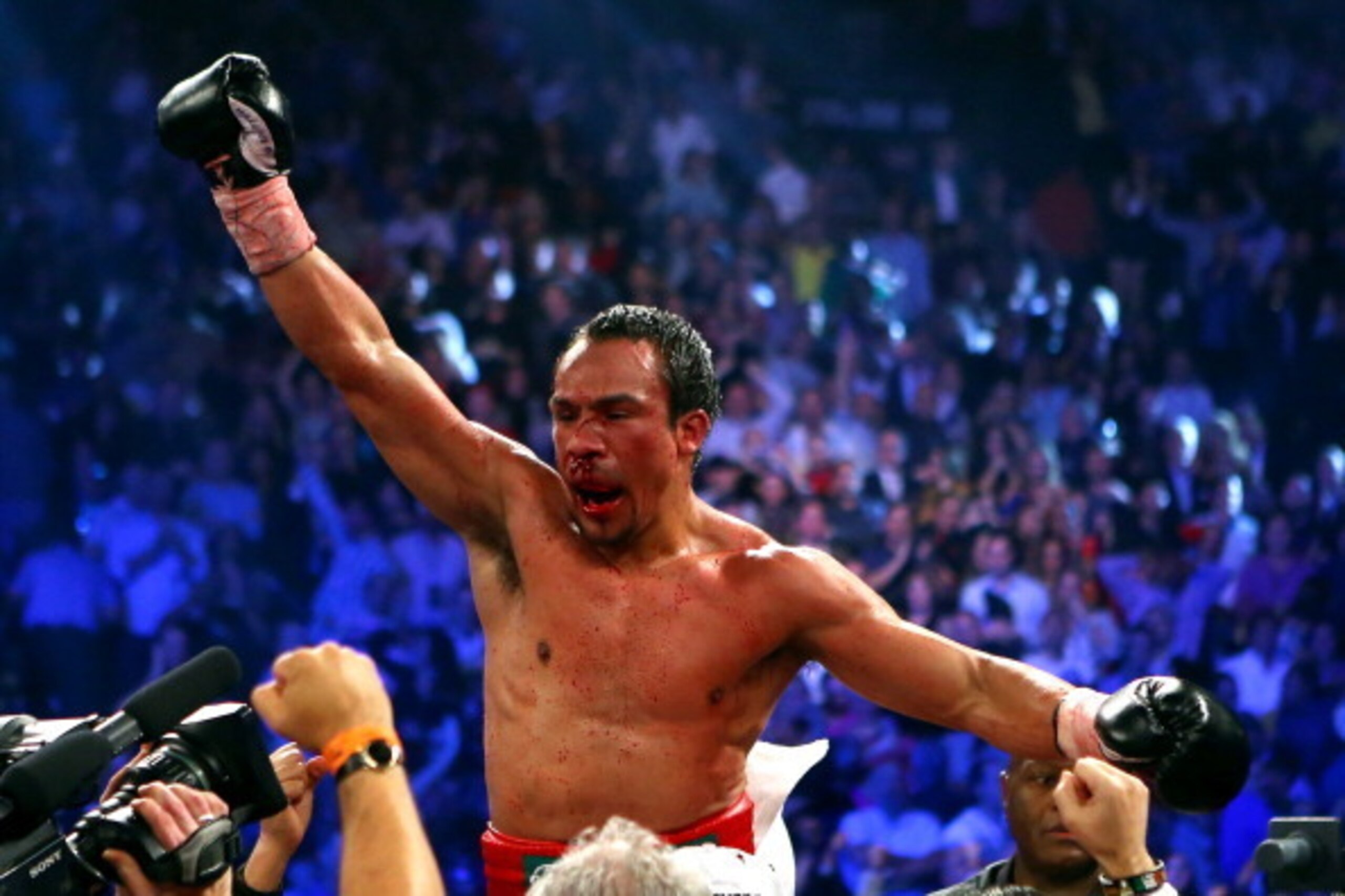 LAS VEGAS, NV - DECEMBER 08:  Juan Manuel Marquez celebrates after defeating Manny Pacquiao by a sixth round knockout in their welterweight bout at the MGM Grand Garden Arena on December 8, 2012 in Las Vegas, Nevada.  (Photo by Al Bello/Getty Images)