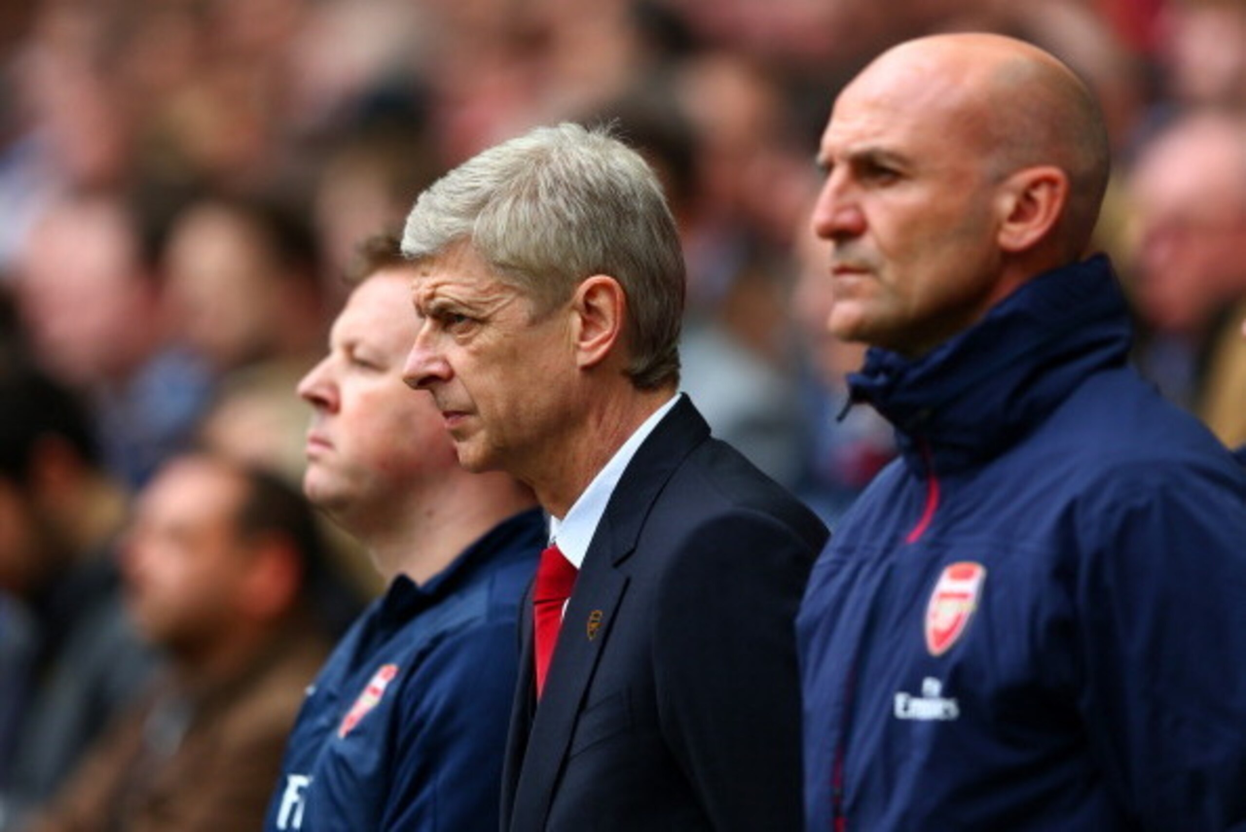 LONDON, ENGLAND - APRIL 12:  Arsene Wenger of Arsenal observes a minute's silence to mark the 25th anniversary of theHillsborough disaster prior to the FA Cup Semi-Final match between Wigan Athletic and Arsenal at Wembley Stadium on April 12, 2014 in Lond