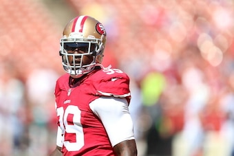 SAN FRANCISCO, CA - SEPTEMBER 22:  Aldon Smith #99 of the San Francisco 49ers looks on during warm-ups against the Indianapolis Colts at Candlestick Park on September 22, 2013 in San Francisco, California.  (Photo by Jed Jacobsohn/Getty Images)