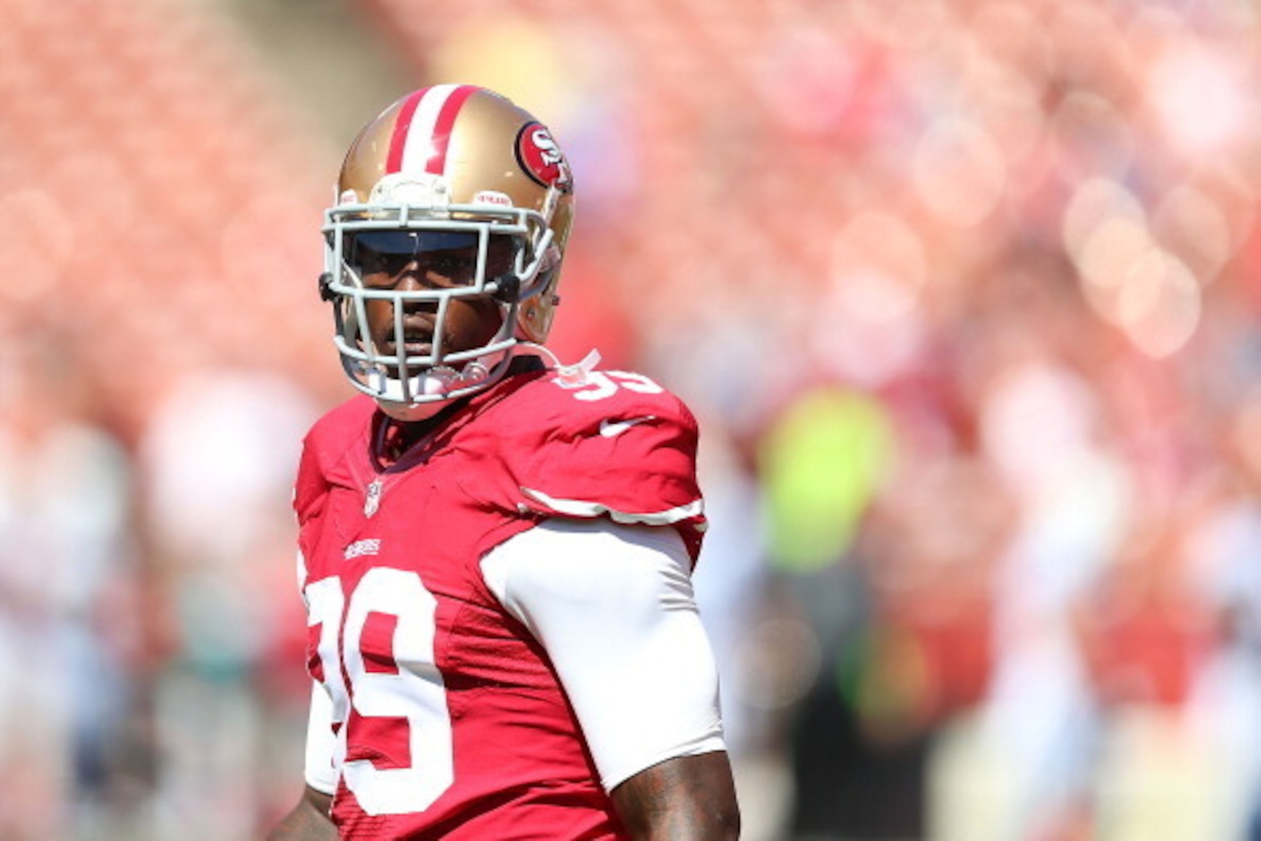 SAN FRANCISCO, CA - SEPTEMBER 22:  Aldon Smith #99 of the San Francisco 49ers looks on during warm-ups against the Indianapolis Colts at Candlestick Park on September 22, 2013 in San Francisco, California.  (Photo by Jed Jacobsohn/Getty Images)