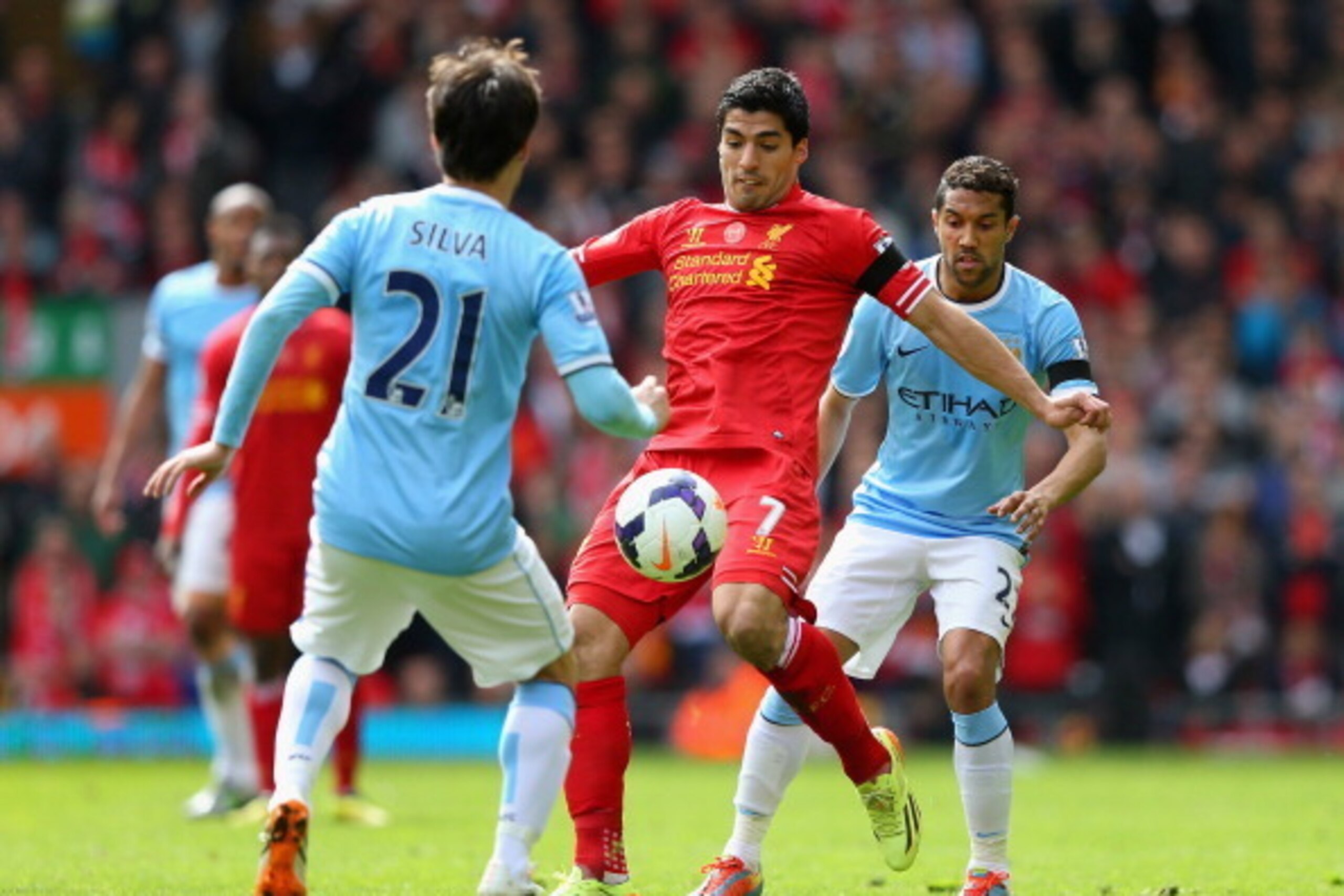 LIVERPOOL, ENGLAND - APRIL 13:  Luis Suarez of Liverpool competes with Gael Clichy and David Silva of Manchester City uring the Barclays Premier League match between Liverpool and Manchester City at Anfield on April 13, 2014 in Liverpool, England.  (Photo