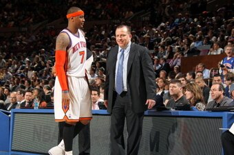 NEW YORK, NY - APRIL 12:  Head coach Tom Thibodeau of the Chicago Bulls talks to Carmelo Anthony #7 of the New York Knicks  during a game on April 12, 2011 at Madison Square Garden in New York City.  NOTE TO USER: User expressly acknowledges and agrees th