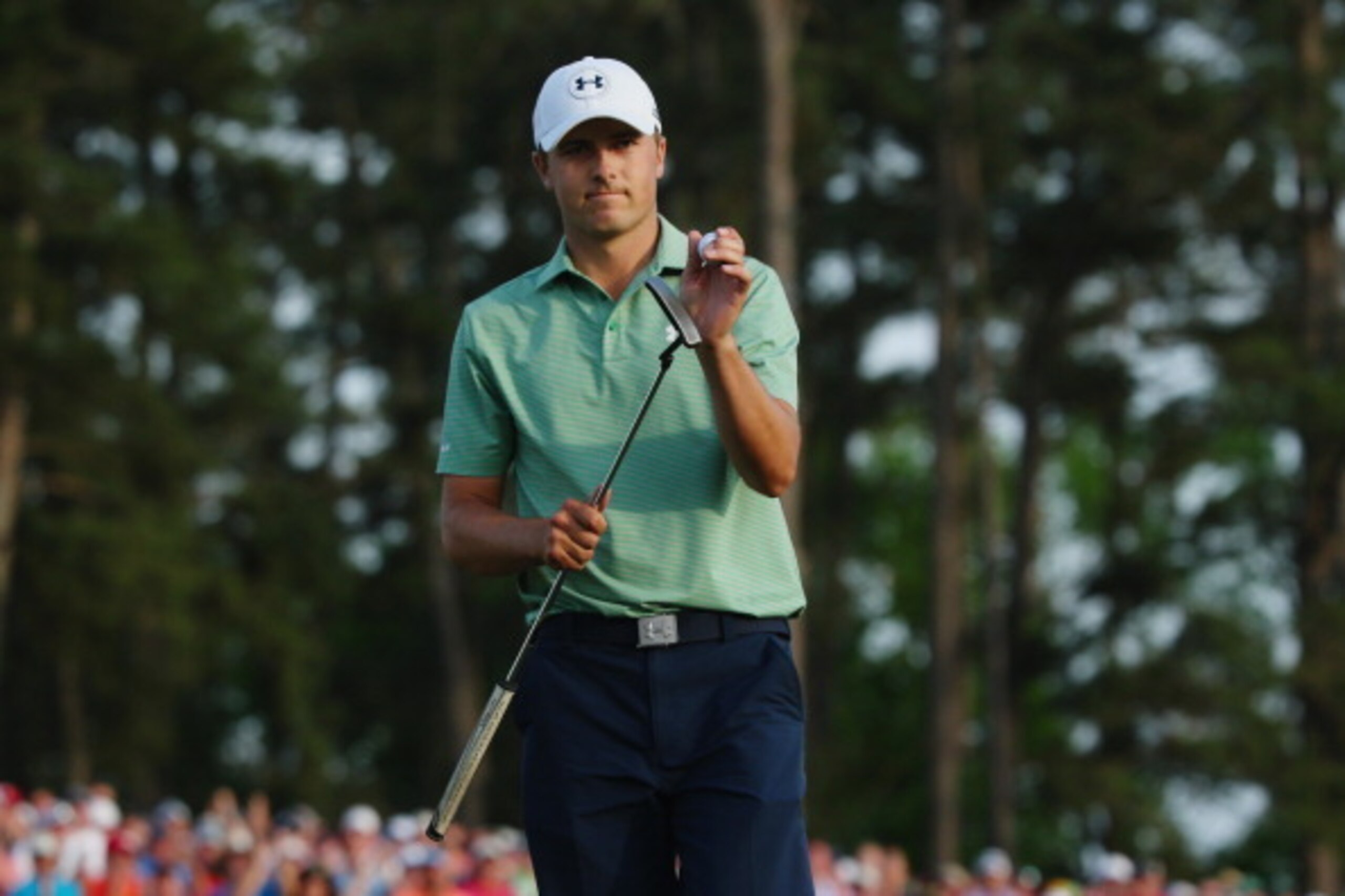 AUGUSTA, GA - APRIL 13:  Jordan Spieth of the United States walks across the 18th green during the final round of the 2014 Masters Tournament at Augusta National Golf Club on April 13, 2014 in Augusta, Georgia.  (Photo by Andrew Redington/Getty Images)