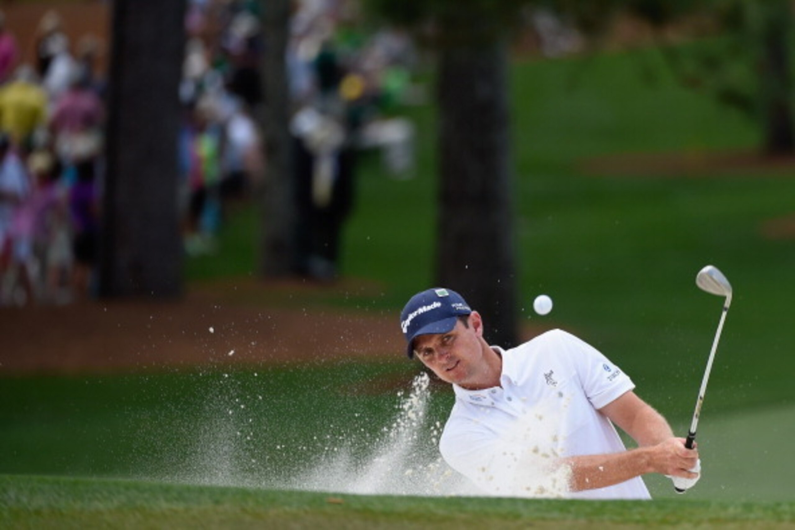 AUGUSTA, GA - APRIL 13:  Justin Rose of England plays a bunker shot on the seventh hole during the final round of the 2014 Masters Tournament at Augusta National Golf Club on April 13, 2014 in Augusta, Georgia.  (Photo by Harry How/Getty Images)