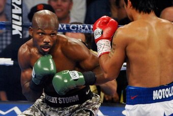 LAS VEGAS, NV - APRIL 12:  Timothy Bradley (L) and Manny Pacquiao battle it out during their WBO world welterweight championship boxing match at the MGM Grand Garden Arena on April 12, 2014 in Las Vegas, Nevada. Pacquiao won by unanimous decision.  (Photo