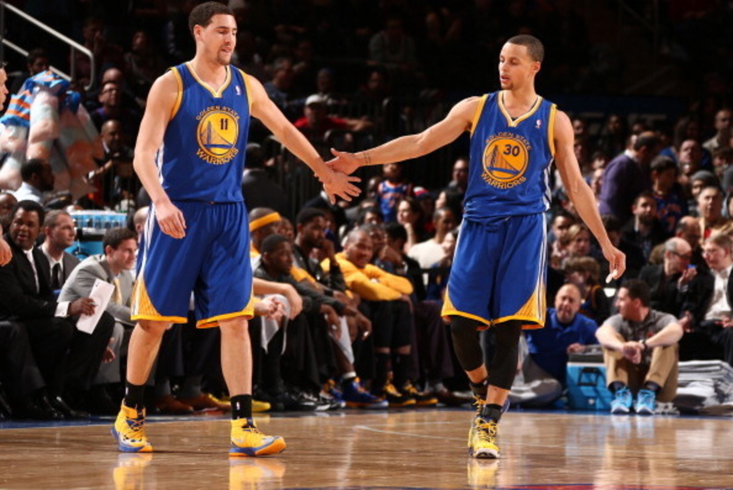 NEW YORK, NY - FEBRUARY 28: Klay Thompson #11 of the Golden State Warriors high-fives teammate Stephen Curry #30 during a game against the New York Knicks at Madison Square Garden in New York City on February 28, 2014.  NOTE TO USER: User expressly acknow