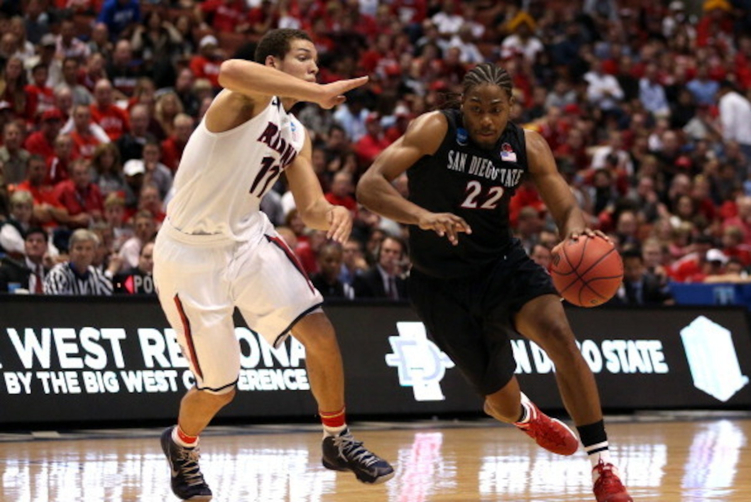 ANAHEIM, CA - MARCH 27:  Josh Davis #22 of the San Diego State Aztecs drives on Aaron Gordon #11 of the Arizona Wildcats in the first half during the regional semifinal of the 2014 NCAA Men's Basketball Tournament at the Honda Center on March 27, 2014 in 